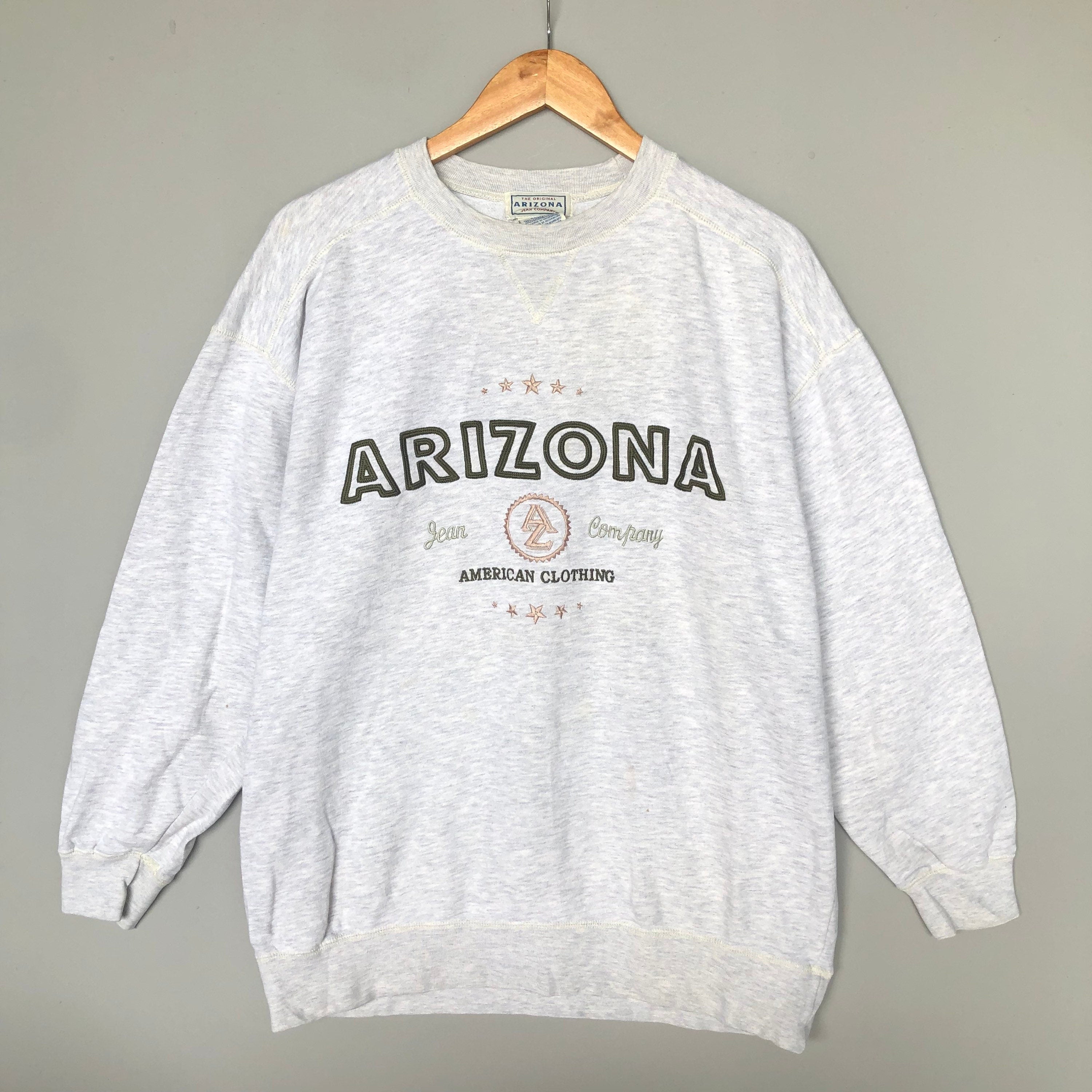 Vintage 90s Arizona Jean Company American Clothing Embroidery Logo Sweatshirt Crewneck Colour Light Grey Size Large Sweatshirt – Premium Graphic · Must-Have Style