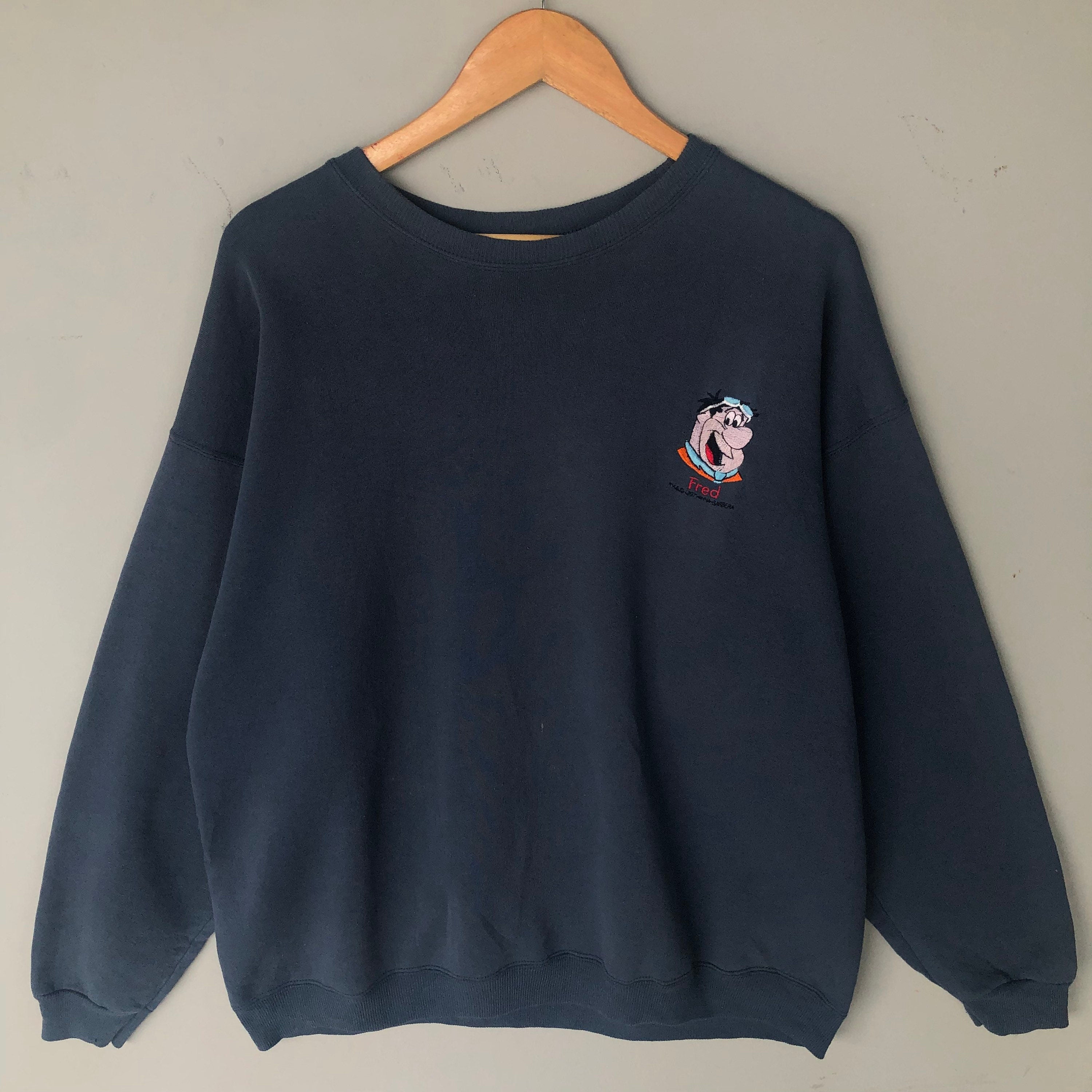Vintage 90s The Flinstones Fred Small Embroided Logo Sweatshirt Baggie Crewneck Pullover Sweater Flinstones Colour Navy Blue Size X large Sweatshirt – Easygoing Wear · High-Quality Print