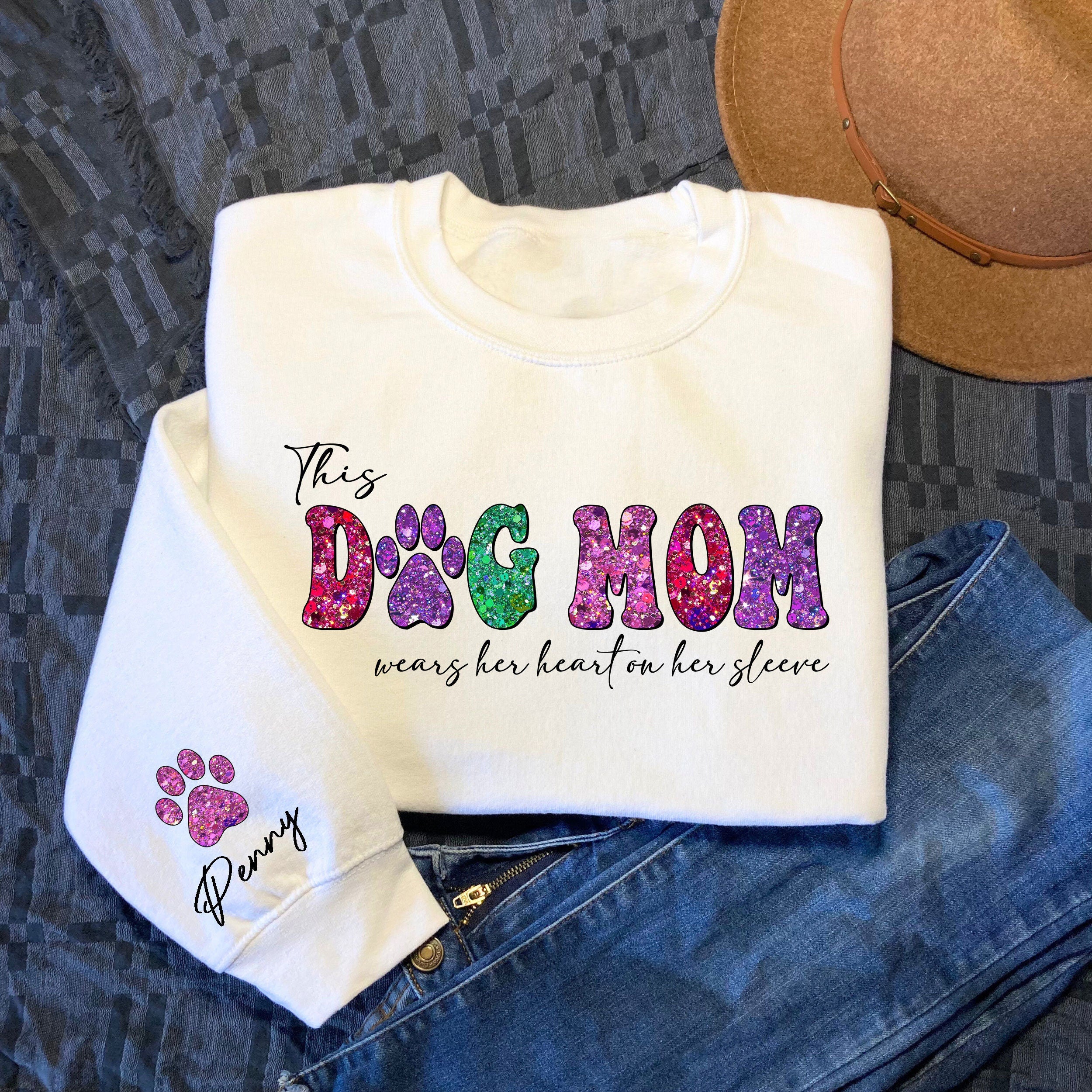 Custom This Dog Mom Wears Her Heart on Her Sleeve Sweatshirt Custom Dog Mama Sweatshirt with Pet Name Dog Mom SweaterMama Valentines Gift Sweatshirt – Premium Graphic · Must-Have Style