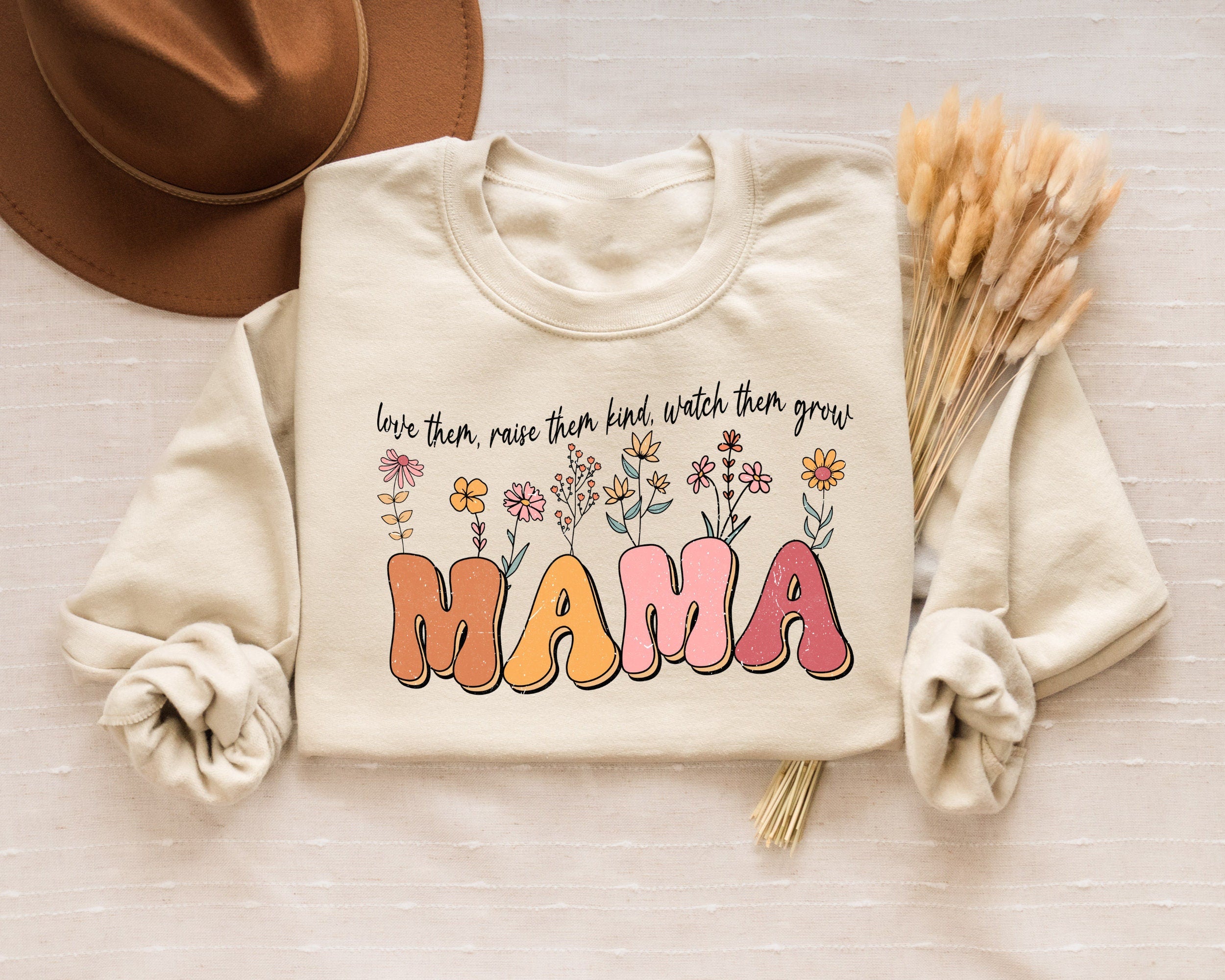 Love Them Raise Them Kind Watch Them Grow Floral Mama Sweatshirt Wildflowers Mama Shirt Spring Mama Shirt Mother39s Day Gift New Mom Gift Sweatshirt – Premium Graphic · Great Gift For Fans