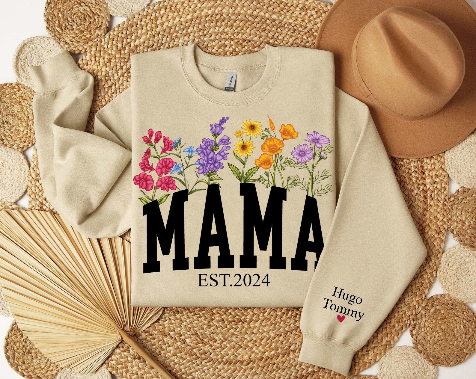 Custom Floral Mama Est Sweatshirt With Kids Name On Sleeve Wildflowers Mom Sweater Personalized Mom Hoodie Mothers Day Gift New Mom Gift Hoodie – Aesthetic Look · Top Pick For Any Outfit