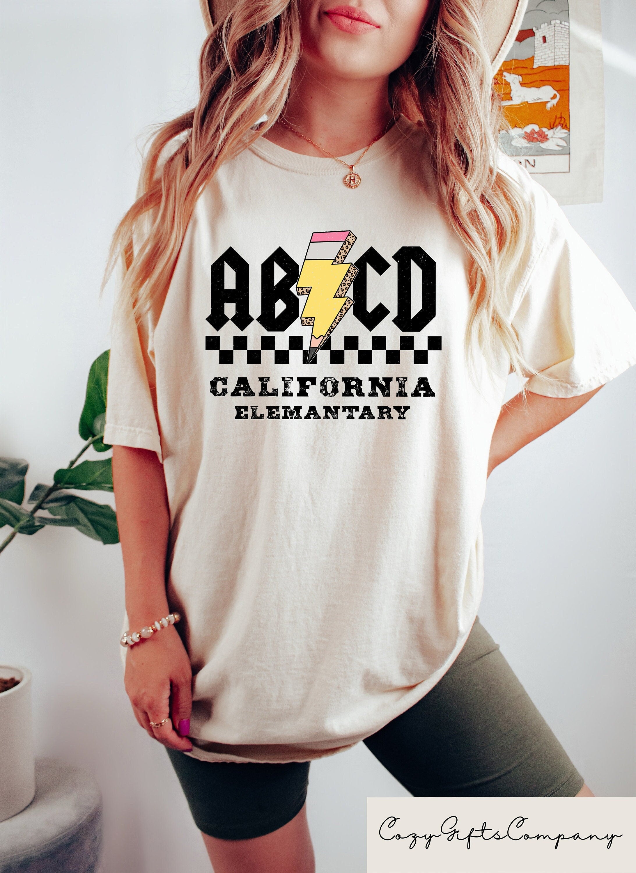 Custom Elementary School Teacher Shirts Bulk School Name Shirts Gift for Teacher Appreciation Week ABCD Shirt for Elementary Teacher Graphic Tee – Aesthetic Look · Top Pick For Any Outfit