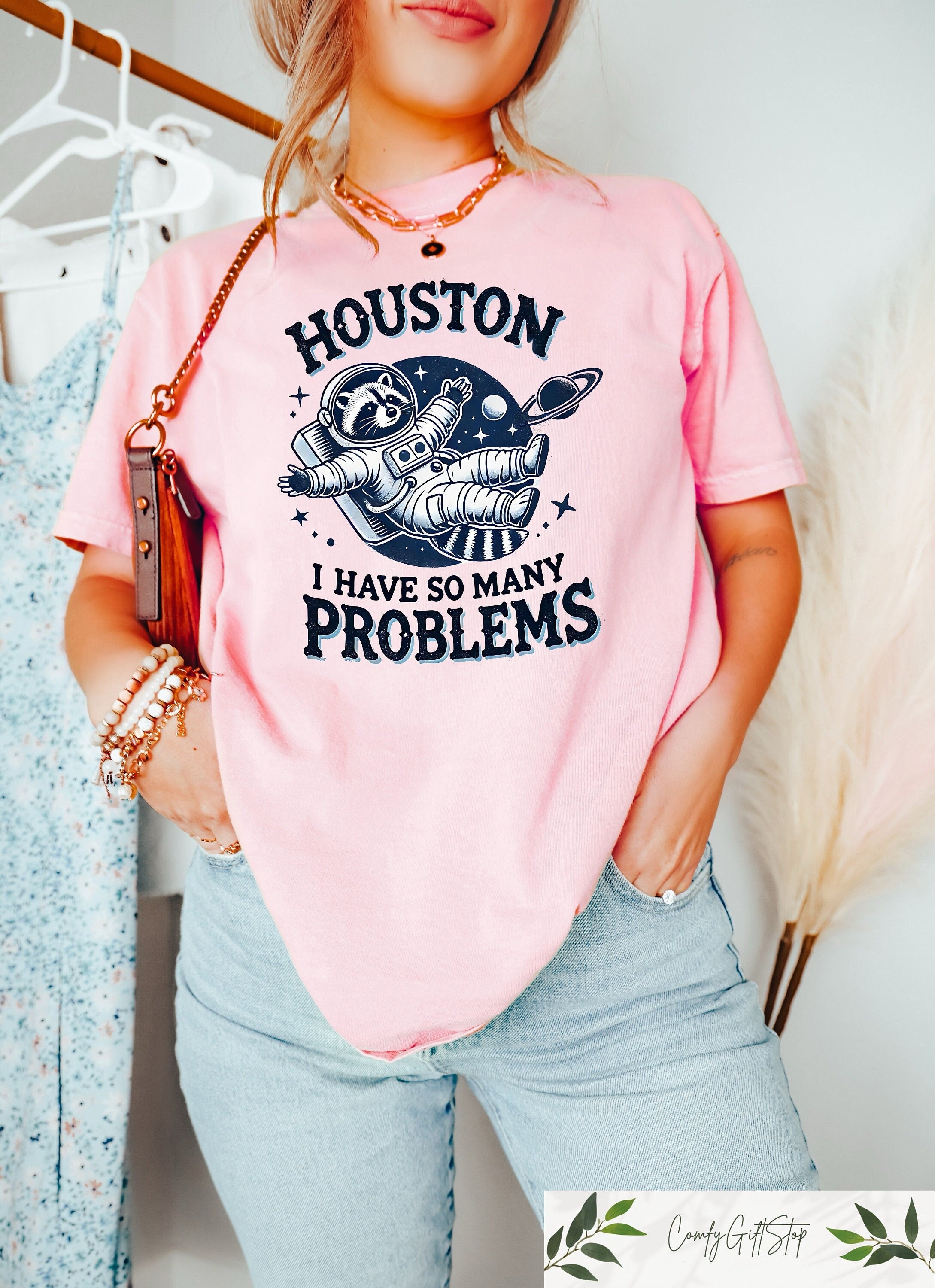 Comfort Retro Funny Raccoon Shirt Houston I Have So Many Problems Funny Graphic Shirt Raccoon In Space Retro Raccoon Outfit Galaxy Tee Graphic Tee – Warm & Stylish · Trending Graphic Apparel