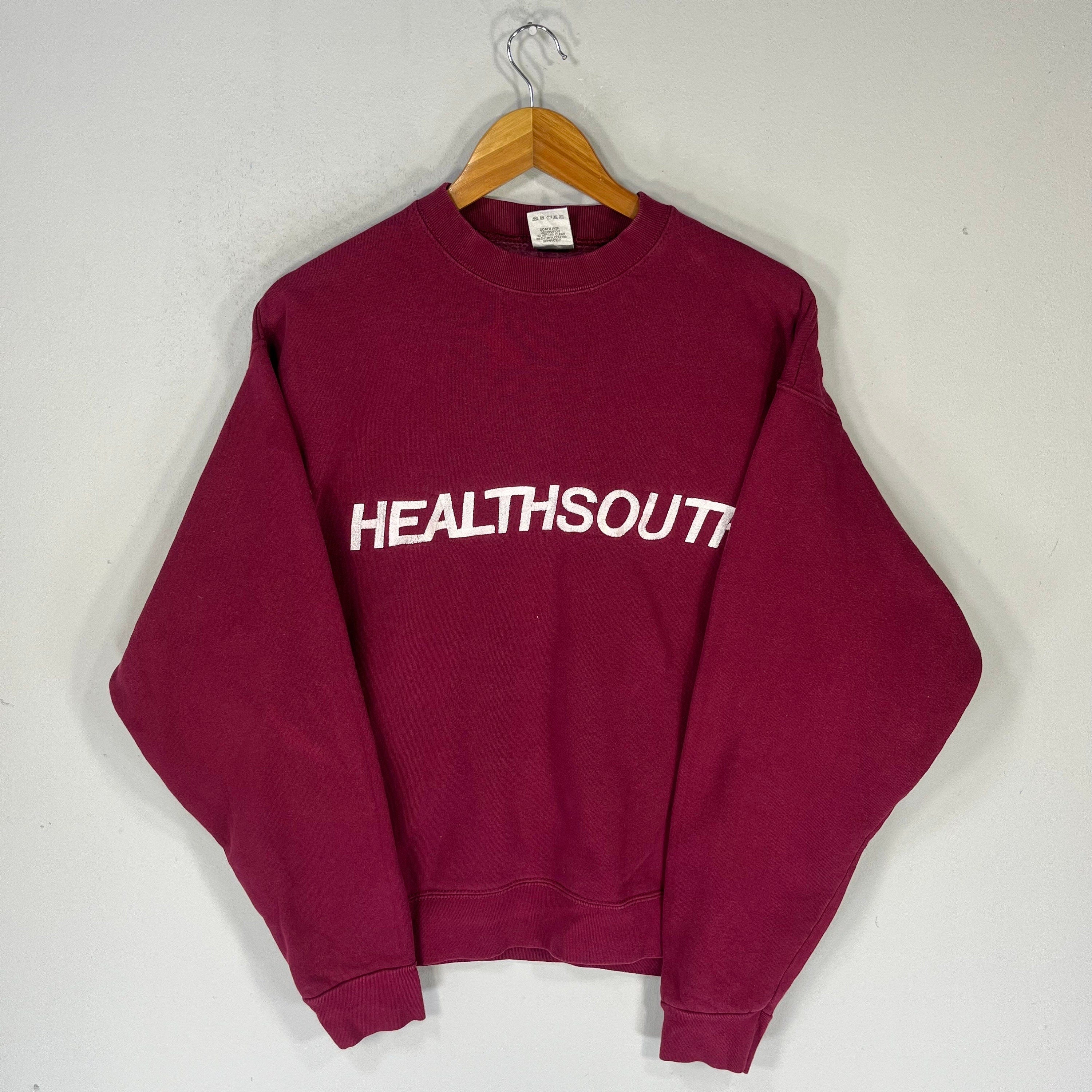 Vintage Fruit Of The Loom Tag HealthSouth Spellout BigLogo Embroidered Sweatshirt Crewneck Sweater Healthsouth Colour Maroon Size Large Sweatshirt – Soft Feel · Trending Graphic Apparel