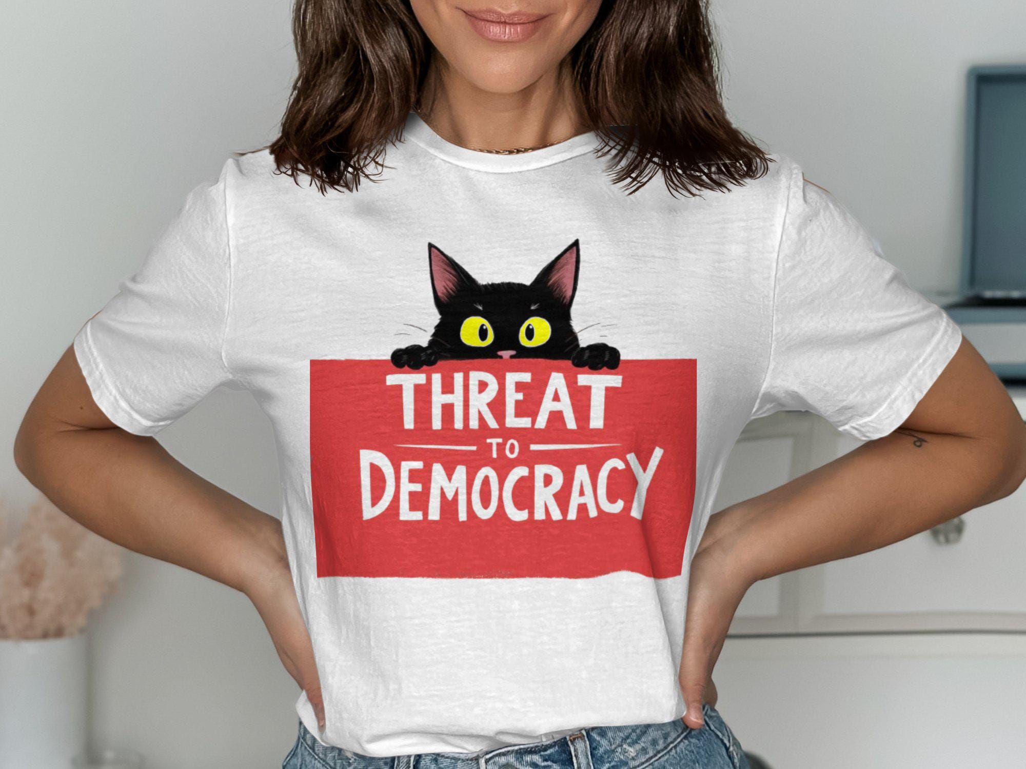 Funny Cat Threat to Democracy T Shirt Graphic Tee – Warm & Stylish · Trending Graphic Apparel