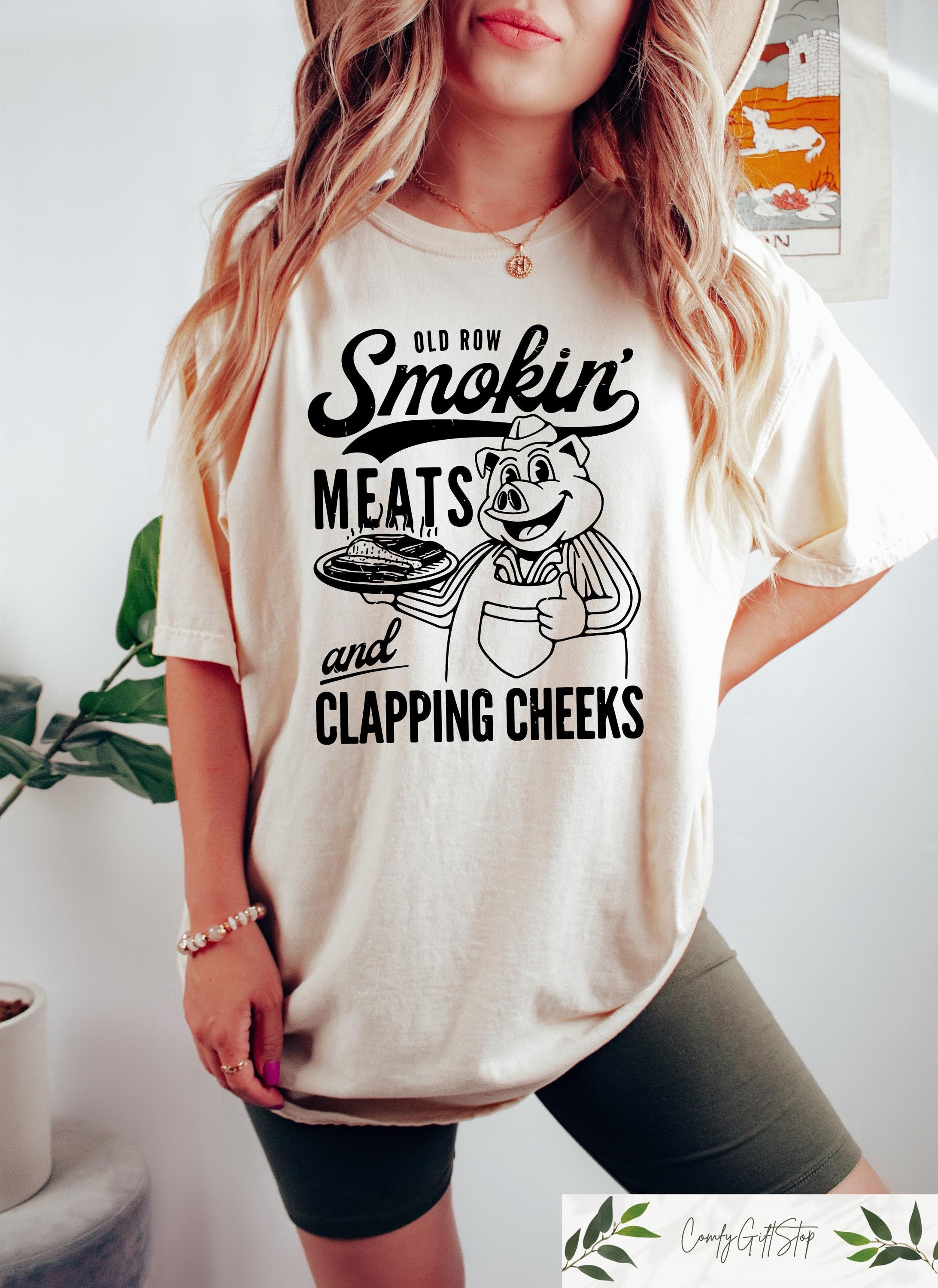 Old Row Smokin39 Meats And Clapping Cheeks Shirt Summer Cookout Gift Funny BBQ Enthusiasts Shirt Kitchen Chef Gifts Funny Cook Shirt Graphic Tee – Fan Favorite · High-Quality Print