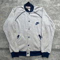 Vintage 1970s Nike Sportswear Snap Button Jacket Graphic Tee – Bold Style · Trending Graphic Apparel