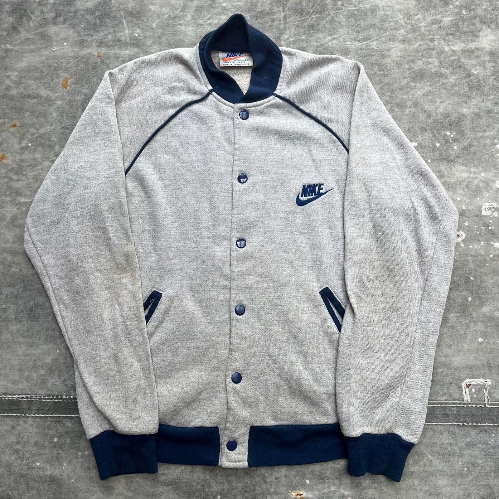 Vintage 1970s Nike Sportswear Snap Button Jacket Graphic Tee – Bold Style · Trending Graphic Apparel