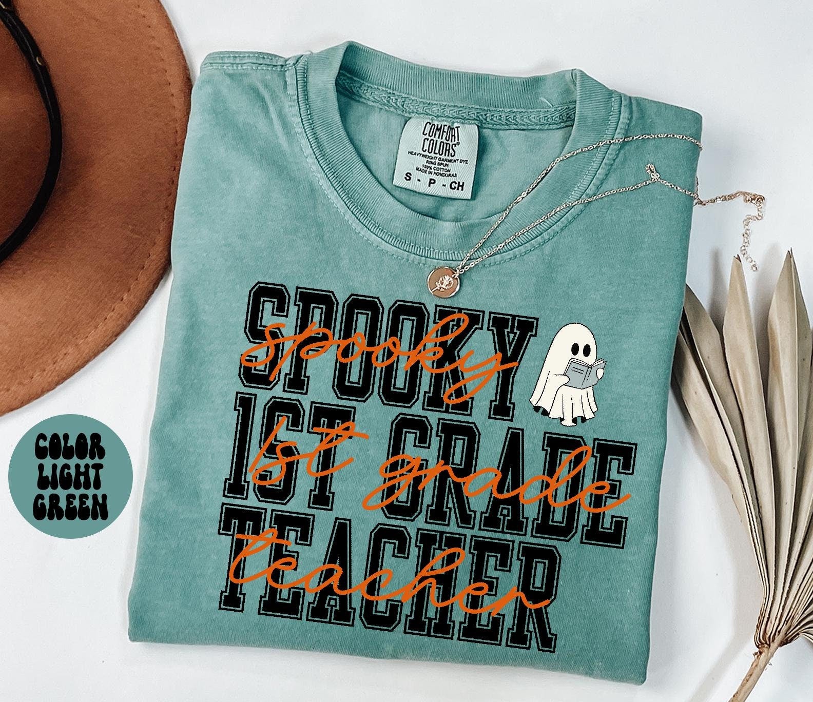 1st Grade Teacher Spooky Halloween Shirt Gifts Comfort Colors Tshirt Crewneck Tee Crew Neck Men Women Graphic Tee – Warm & Stylish · Must-Have Style