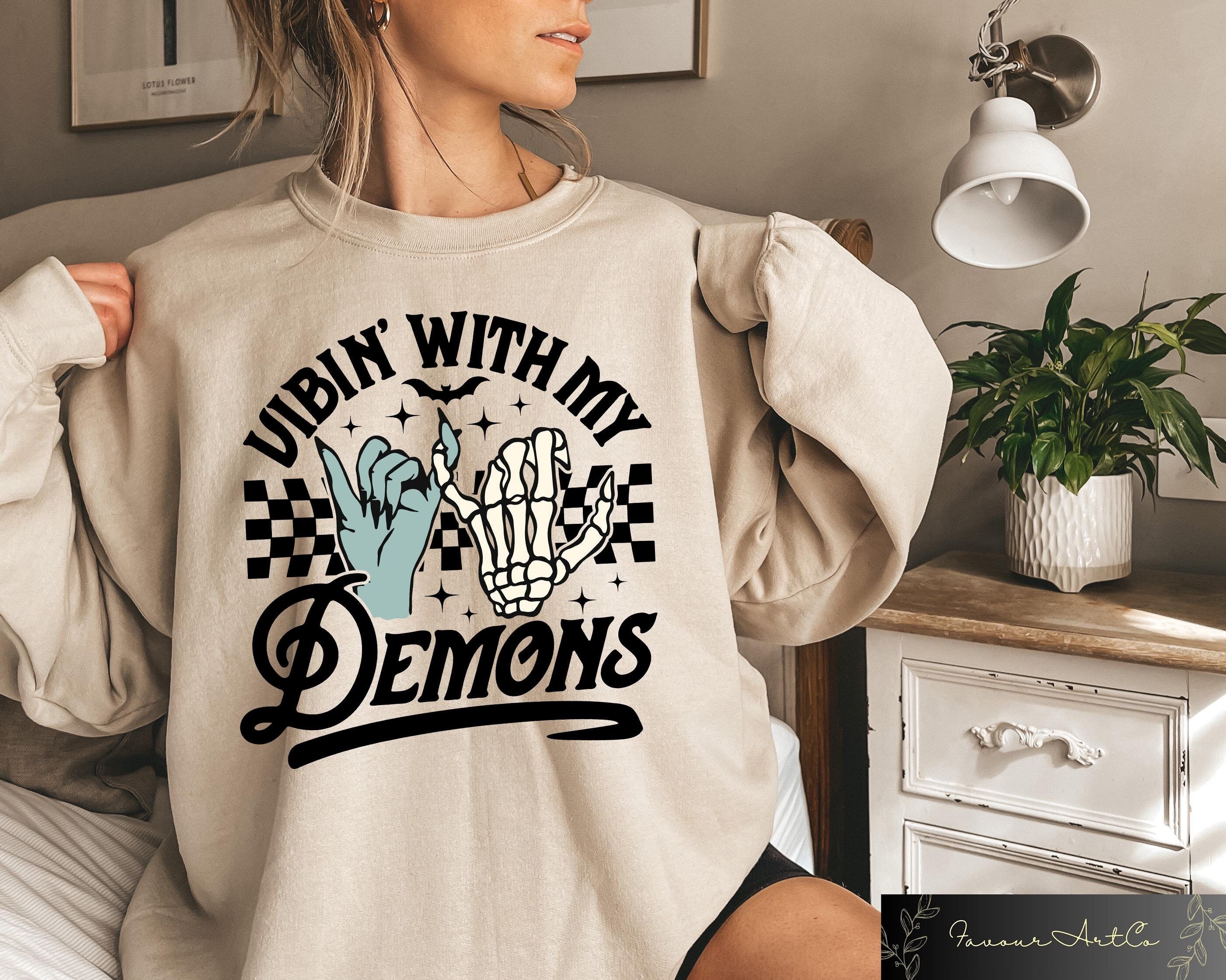Funny Halloween Sweatshirt Vibin With My Demons Tee Retro Halloween Hoodie Halloween Costume Retro Halloween Tshirt Spooky Season Gift Hoodie – Premium Graphic · Great Gift For Fans