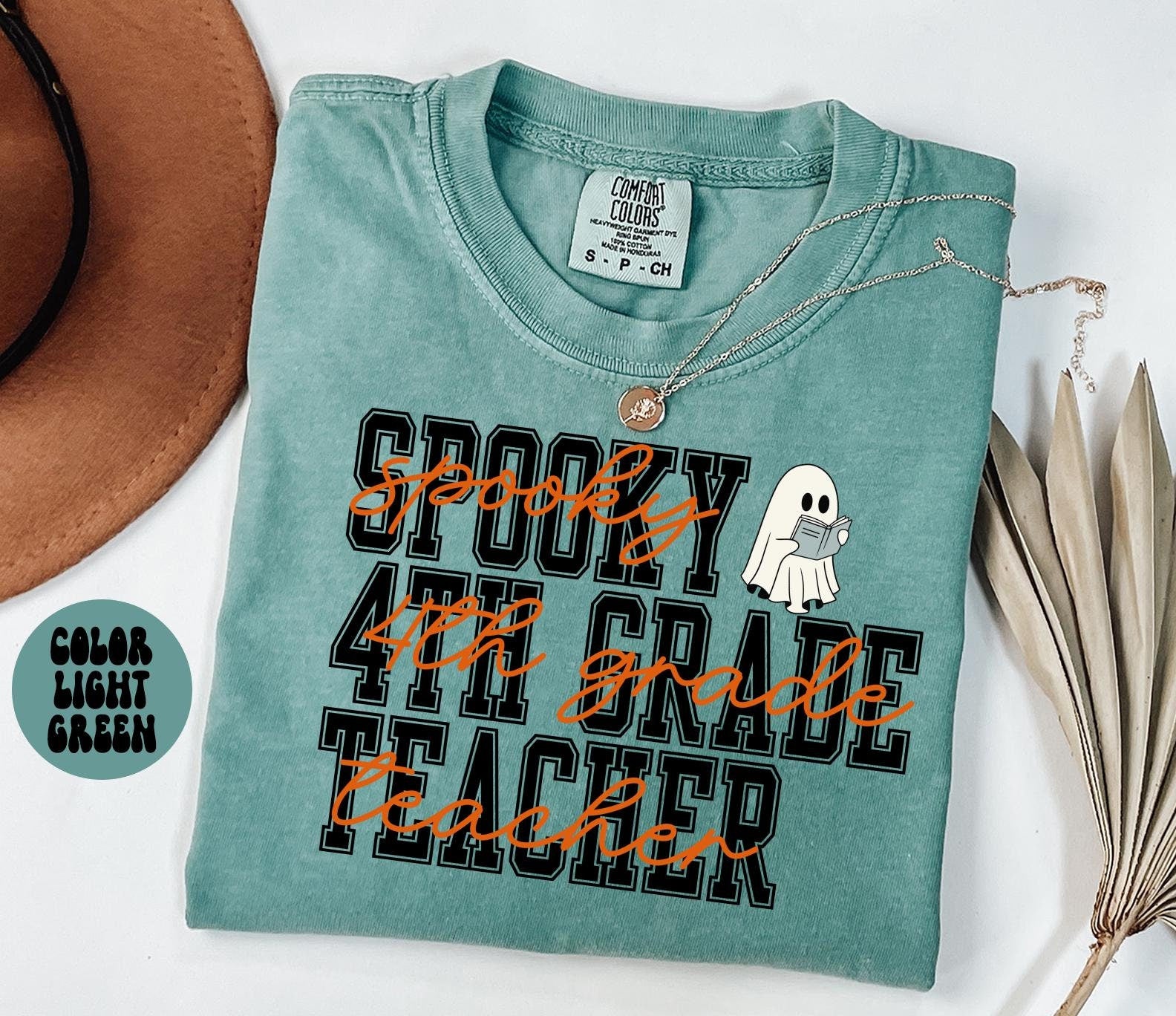 4th Grade Teacher Spooky Halloween Shirt Gifts Comfort Colors Tshirt Crewneck Tee Crew Neck Men Women Graphic Tee – Warm & Stylish · Must-Have Style