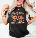 Halloween Fall In Love With Learning Sweatshirt Halloween Gift For Teachers Spooky Halloween Shirt Trick Or Teach Pumpkin Tee Sweatshirt – Premium Graphic · Must-Have Style