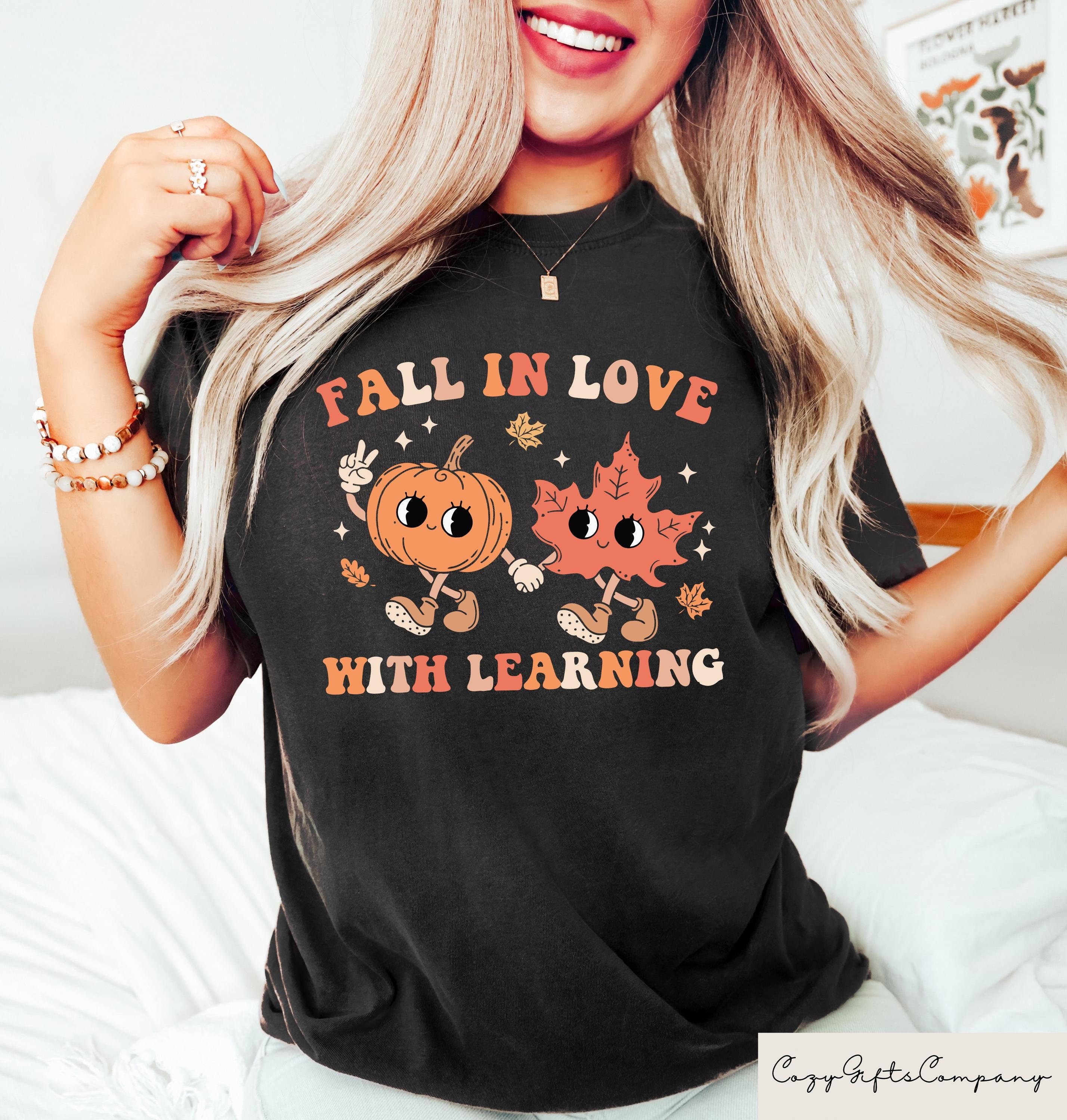 Halloween Fall In Love With Learning Sweatshirt Halloween Gift For Teachers Spooky Halloween Shirt Trick Or Teach Pumpkin Tee Sweatshirt – Premium Graphic · Must-Have Style