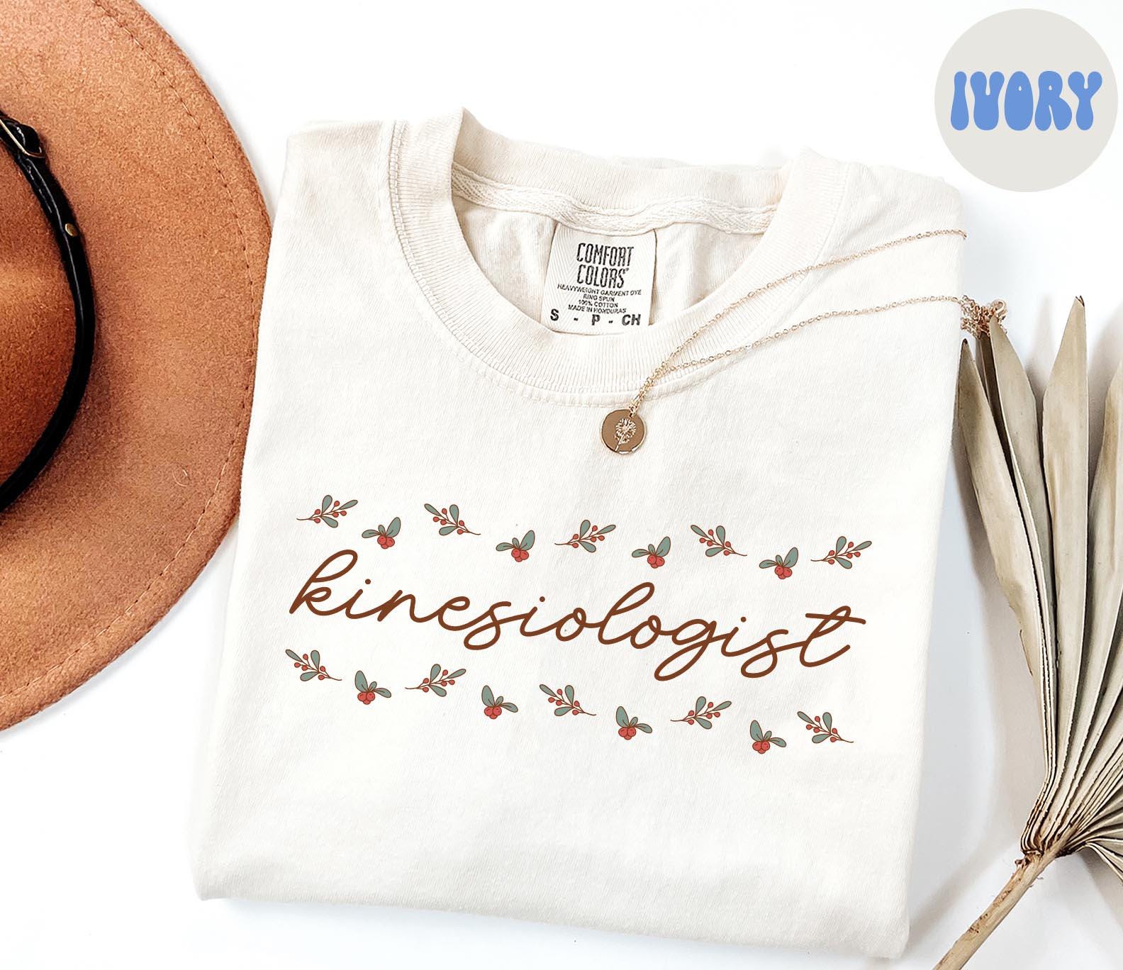 Kinesiologist Christmas Shirt Kinesiology Shirt Gifts Holly Shirt Comfort Colors Tshirt Crewneck Tee Women Graphic Tee – Soft Feel · High-Quality Print