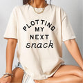 Plotting My Next Snack Shirt Funny Foodie Tee Baking Shirt Food Lover Gift Weird Shirt Vegan Shirt dietitian gifts Gen Z Shirt Graphic Tee – Aesthetic Look · Top Pick For Any Outfit