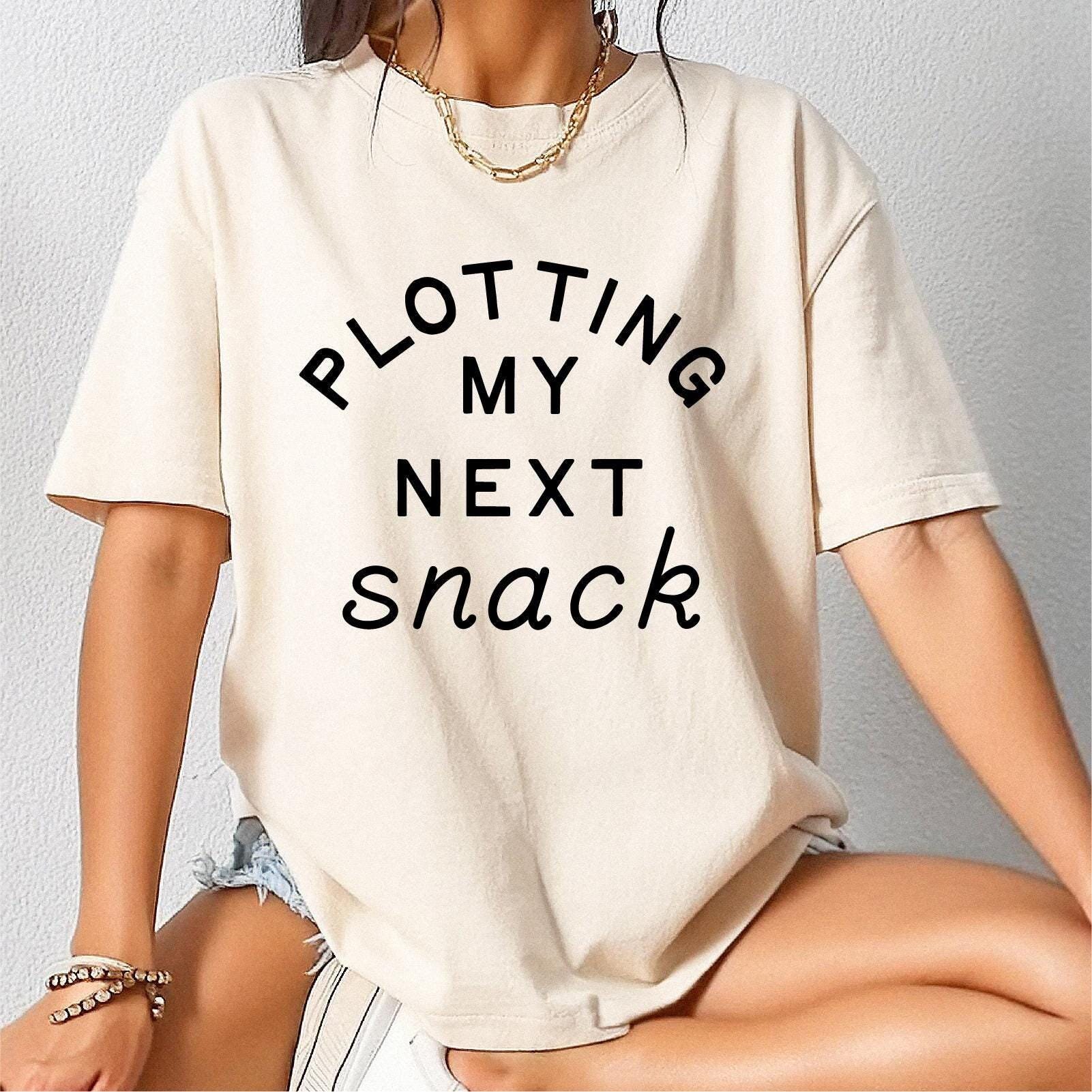 Plotting My Next Snack Shirt Funny Foodie Tee Baking Shirt Food Lover Gift Weird Shirt Vegan Shirt dietitian gifts Gen Z Shirt Graphic Tee – Aesthetic Look · Top Pick For Any Outfit