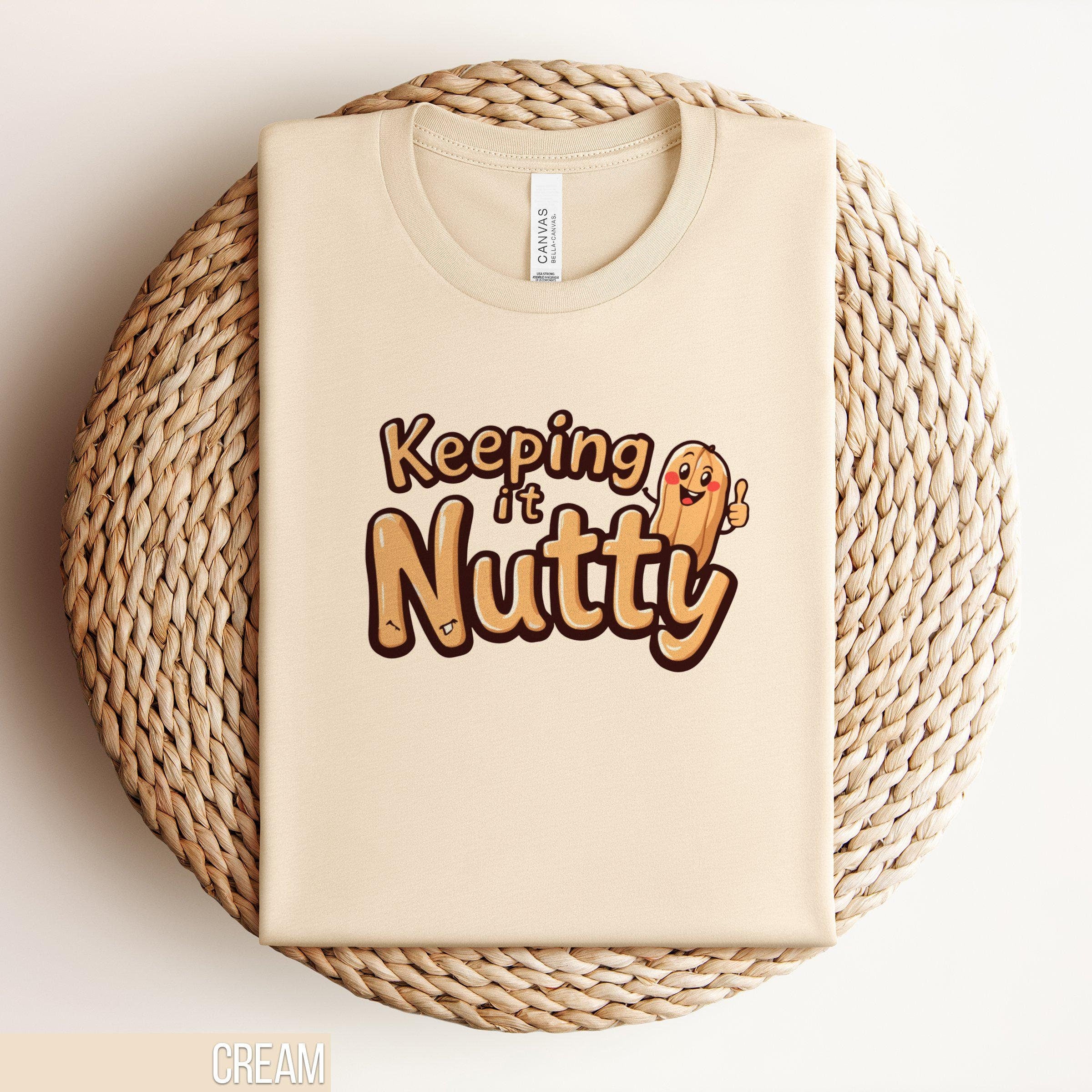 Keeping It Nutty Funny T Shirt Cute Peanut Cartoon Graphic Tee Humorous Foodie Shirt for Nut Lovers Unisex T Shirt Gift Funny Saying Tee Graphic Tee – Aesthetic Look · Top Pick For Any Outfit