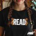 READ Between the Lions Cat T Shirt Encouraging Literacy Feline Fun Perfect Gift for Teachers Librarians Book Lovers Graphic Tee – Fan Favorite · High-Quality Print