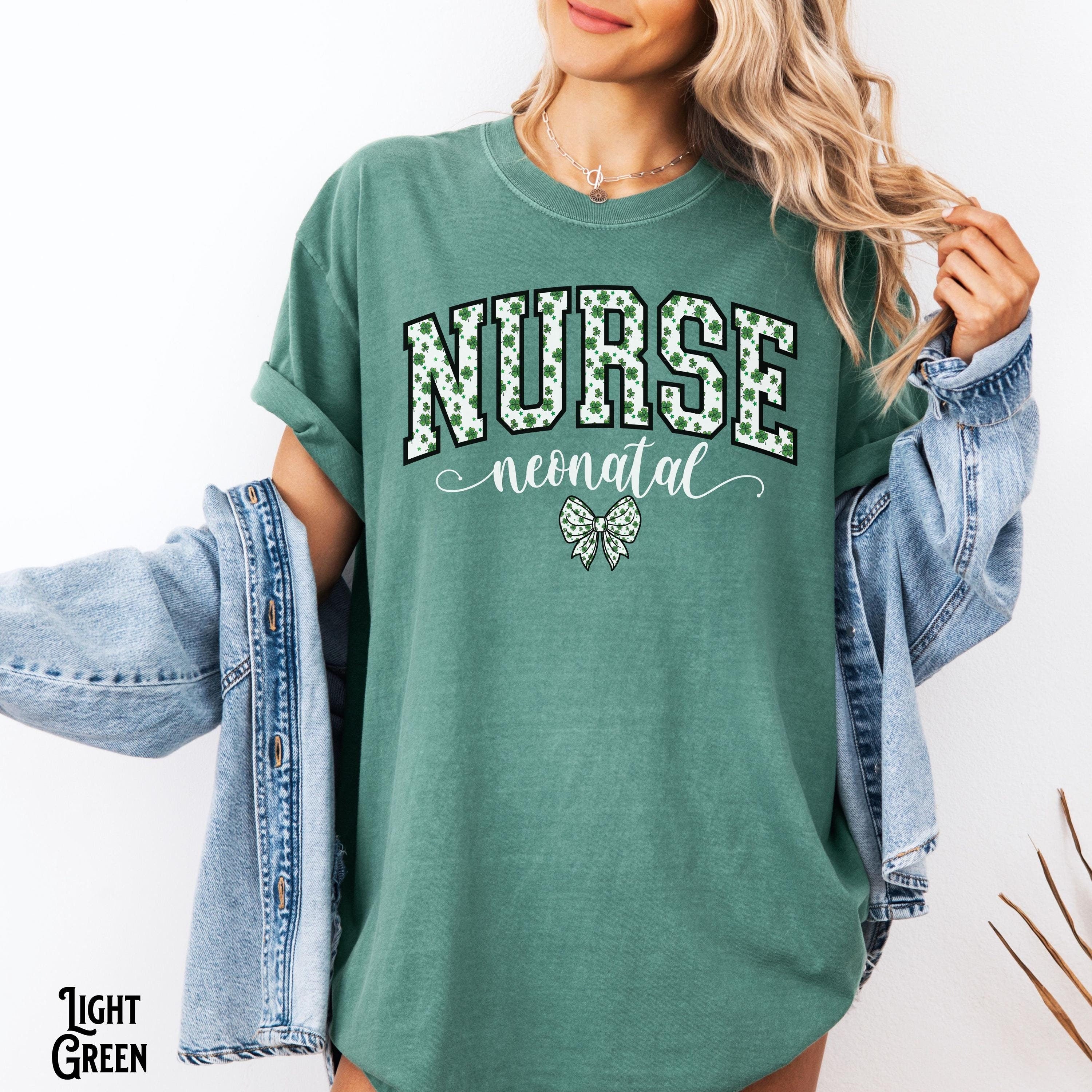 NICU Nurse St Patrick39s Day Shirt Neonatal Intensive Care Unit Saint Patrick Varsity Bow Coquette RN Crew Gift Graphic Tee – Bold Style · Trending Graphic Apparel
