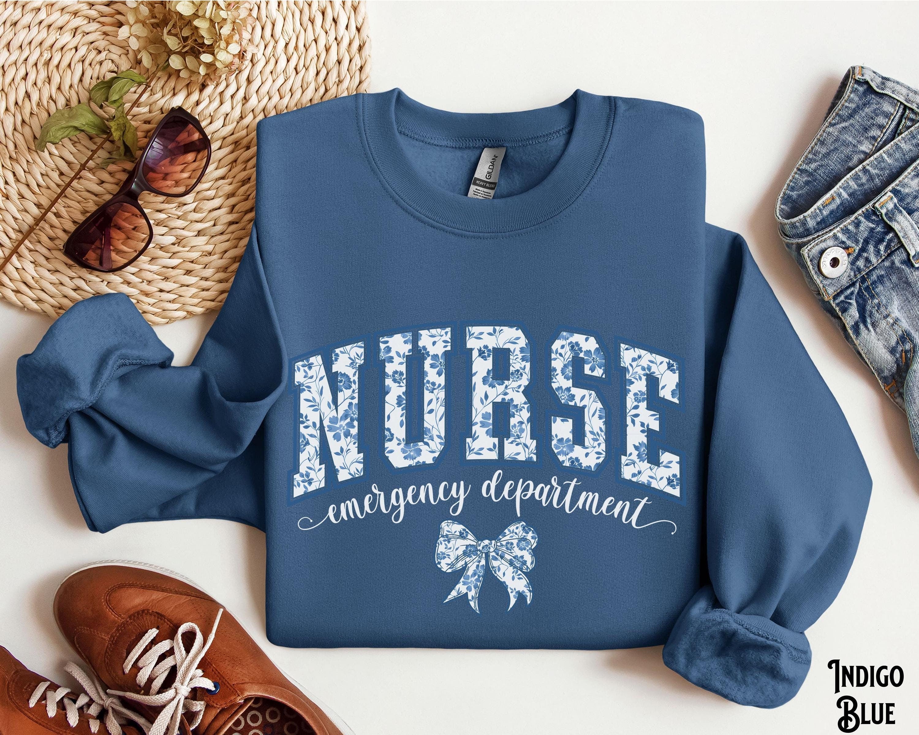 Emergency Department Nurse Sweatshirt Varsity Coquette Bow ER Crewneck ER Department Sweater Hospital Nursing Blue Floral Gift Sweatshirt – Fan Favorite · Top Pick For Any Outfit