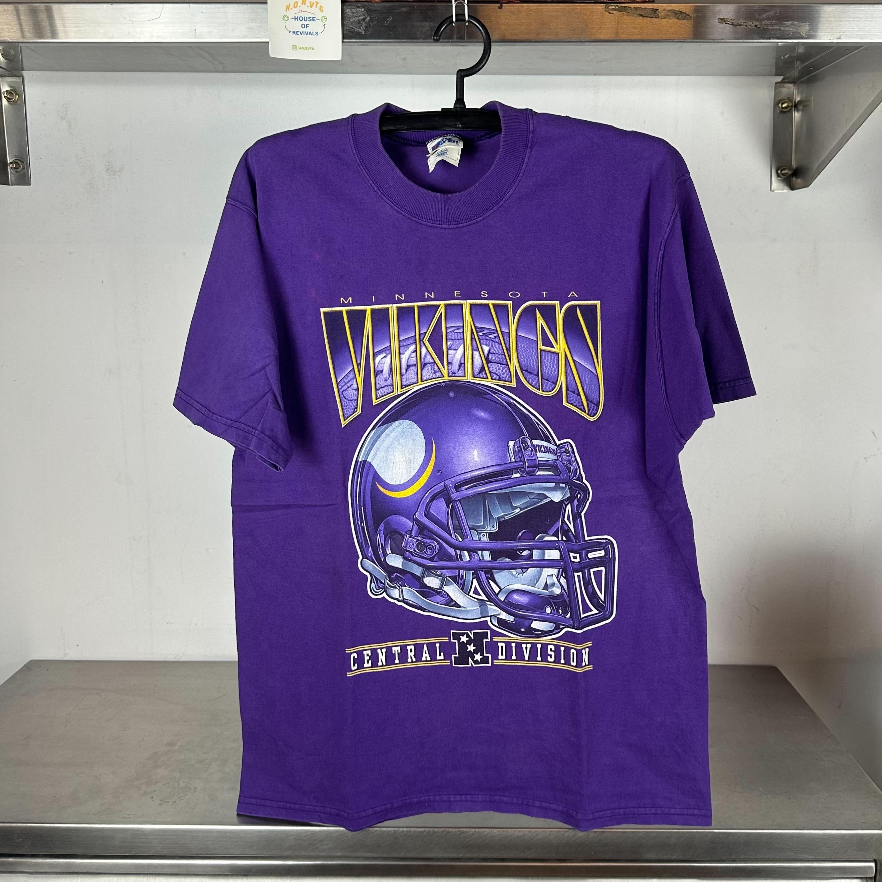 Vintage 90s Minnesota Vikings Helmet Football Central Division NFL T shirt Vintage Sports Tshirts NFL Tshirts Minnesota Vikings Tshirts Graphic Tee – Bold Style · High-Quality Print