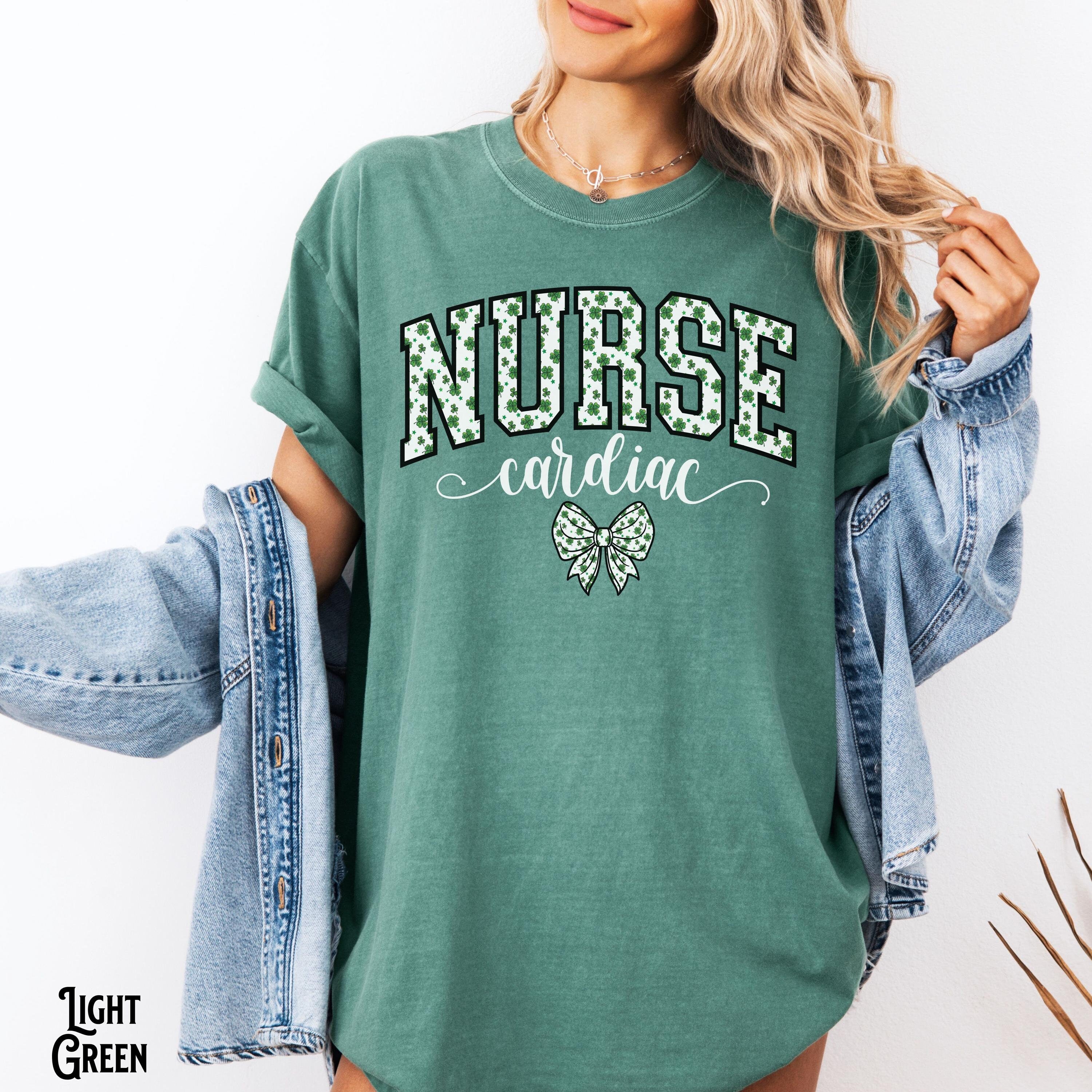 Cardiac Nurse St Patrick39s Day Shirt Saint Patrick Varsity Vascular Heart Nurse RN NP CVICU Bow Coquette Gift Graphic Tee – Premium Graphic · Trending Graphic Apparel