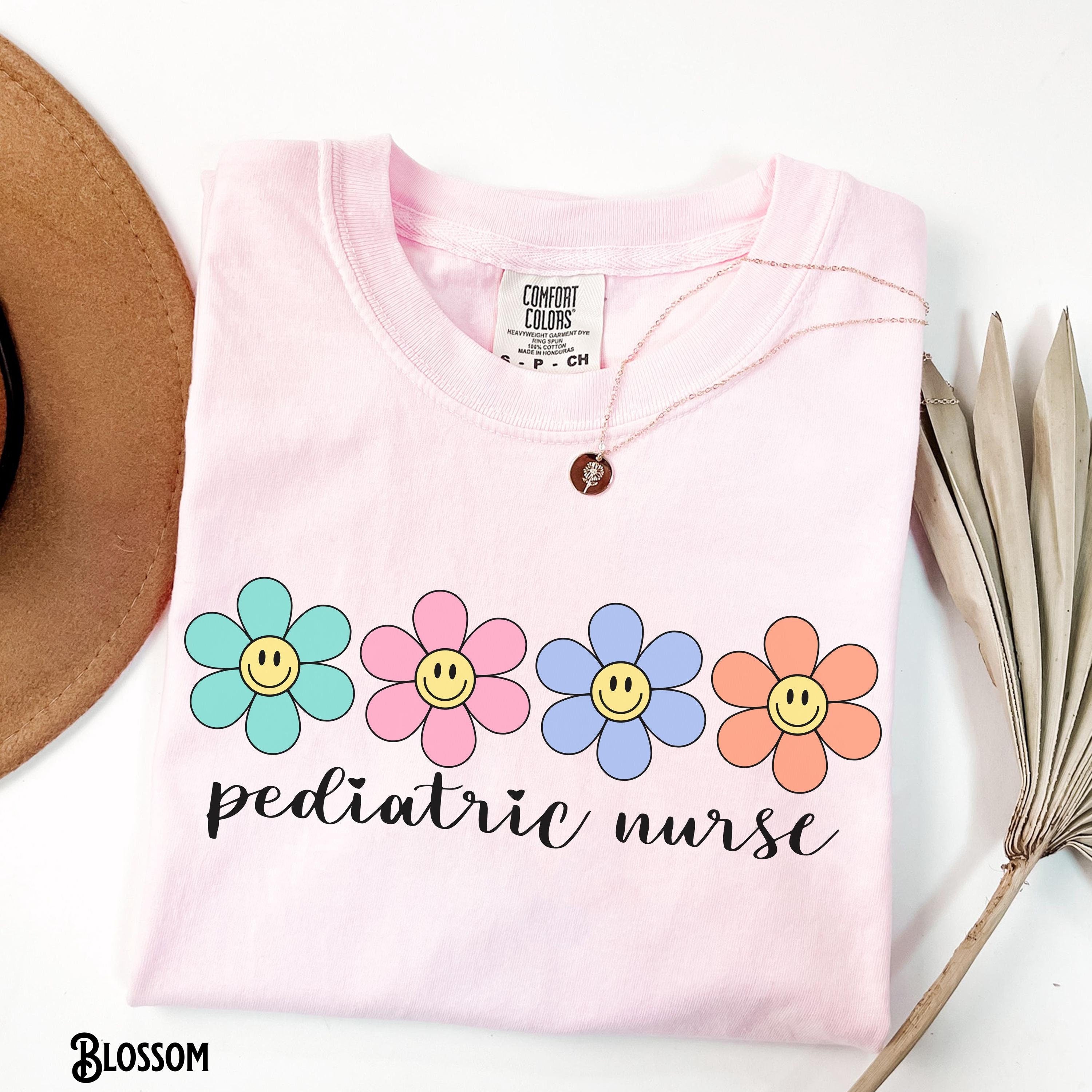 Pediatric Nurse Flower Shirt PEDS Nurse Tee Pediatrics RN Tshirt PICU Shirt Floral Pediatric Happy Face Nursing Gift Graphic Tee – Everyday Comfort · Great Gift For Fans