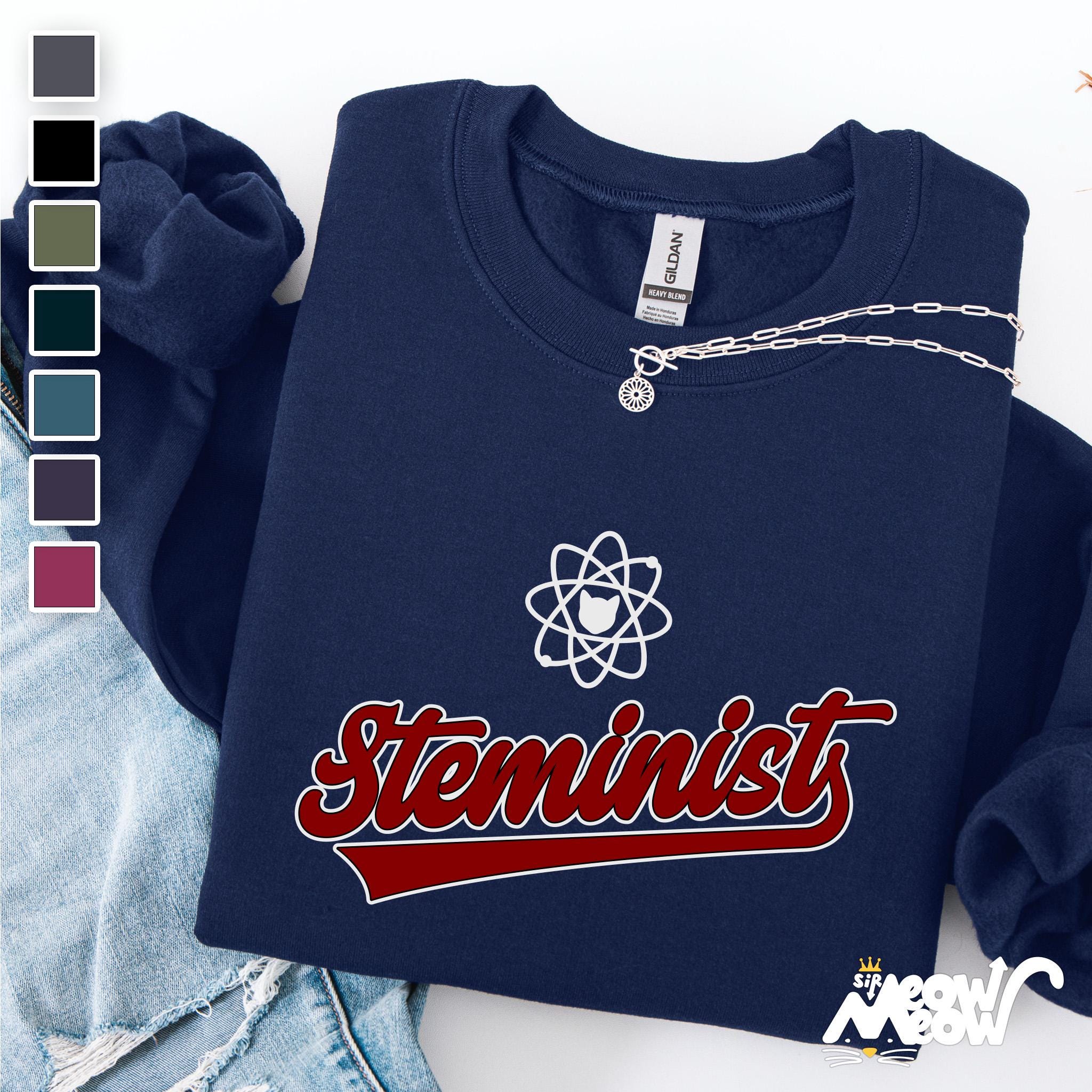 Steminist Sweatshirt Unisex STEM Feminist Apparel Perfect for Science Enthusiasts Ideal Gift for STEM Student Sweatshirt – Fan Favorite · Trending Graphic Apparel