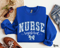 Registered Nurse Sweatshirt RN Varsity Sweater Coquette Bow Blue Floral RN Crewneck Girly Hospital Nursing Chinoiserie Gift for RN Sweatshirt – Soft Feel · Perfect For Daily Wear