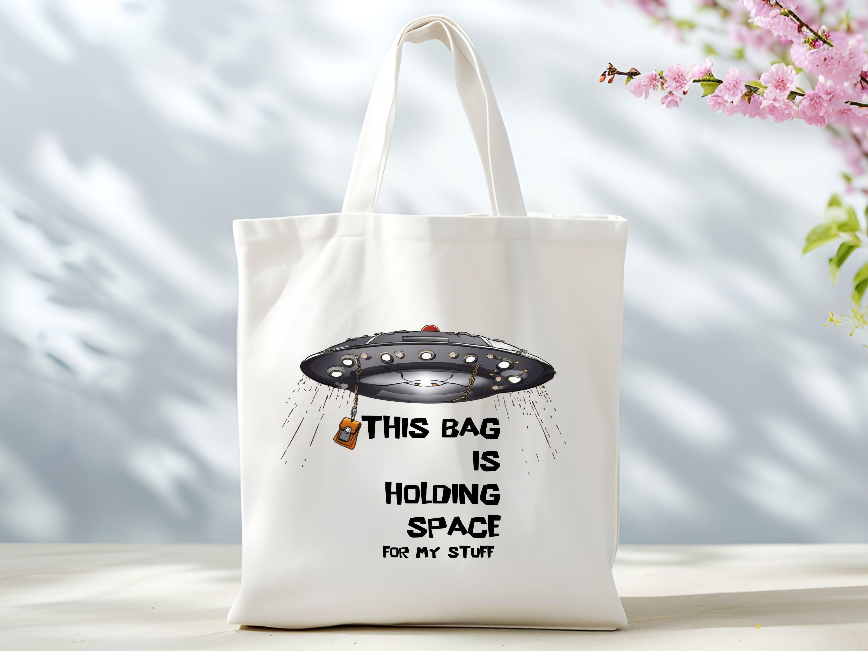 Holding Space Tote Bag it39s literally holding space for my stuff Bag Funny Gift Bag Humorous Shopping Bag Defying Gravity Market Bag Tote Bag – Aesthetic Look · Great Gift For Fans
