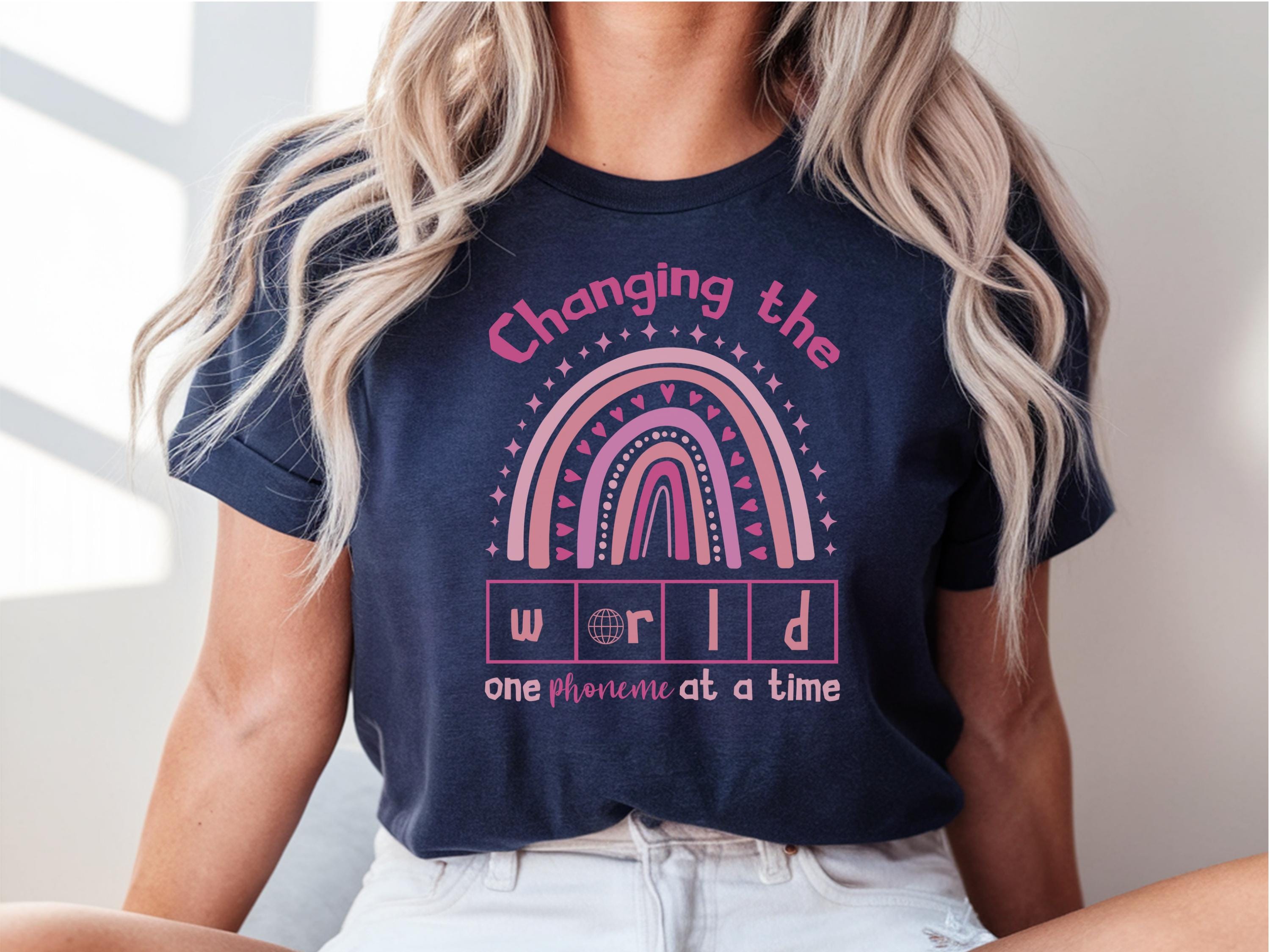 Changing The World One Phoneme At A Time Shirt Literacy Coach Shirt Literacy Coach Teacher Shirt Read Librarian Shirt Graphic Tee – Warm & Stylish · Trending Graphic Apparel