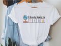 I Teach Kids To Read Shirt Literacy Coach Shirt Literacy Coach Teacher Shirt Reading Teacher Shirt Read Librarian Shirt Literacy Shirt Graphic Tee – Aesthetic Look · Perfect For Daily Wear