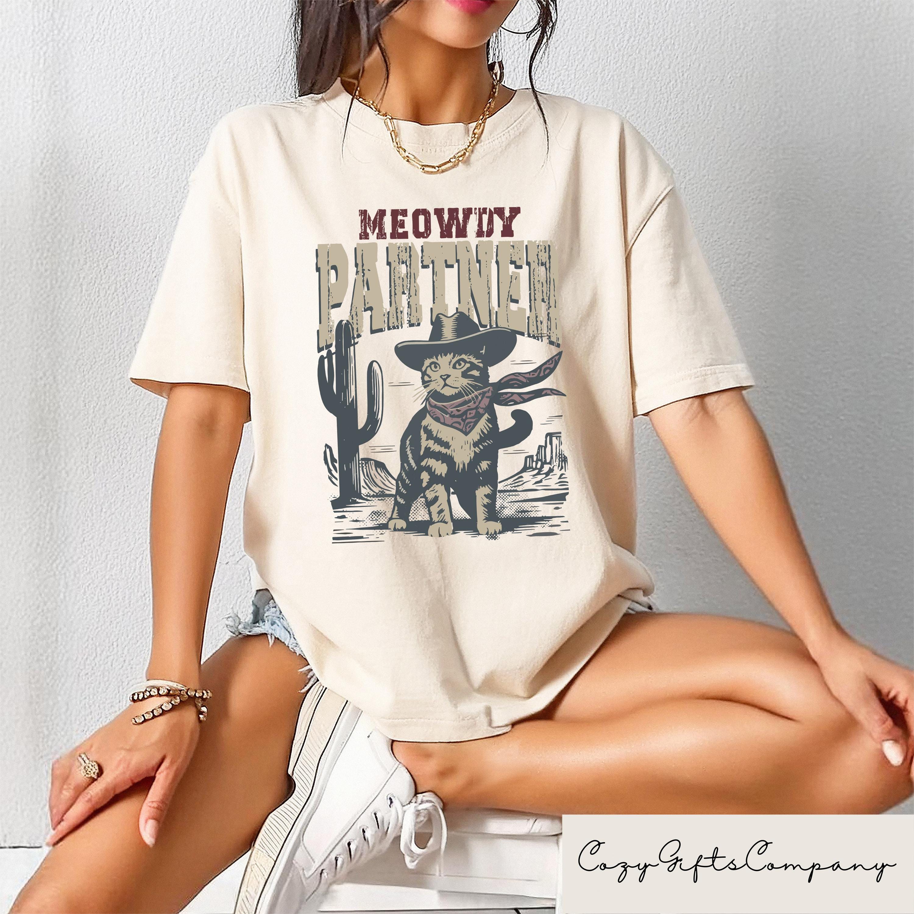 Meowdy Partner Whiskers In The Wind T shirt Cowboy Cat Shirt Retro Cowboy Shirt Western Cat Lover Gift Funny Cowboy Cat Crewneck Graphic Tee – Premium Graphic · Great Gift For Fans