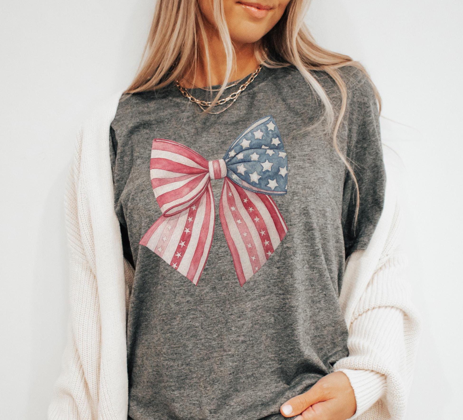 4th of July Bow Shirt American Flag Tee with Coquette Bow Perfect for Independence Day 4th July Shirt Gift Idea Graphic Tee – Premium Graphic · Perfect For Daily Wear