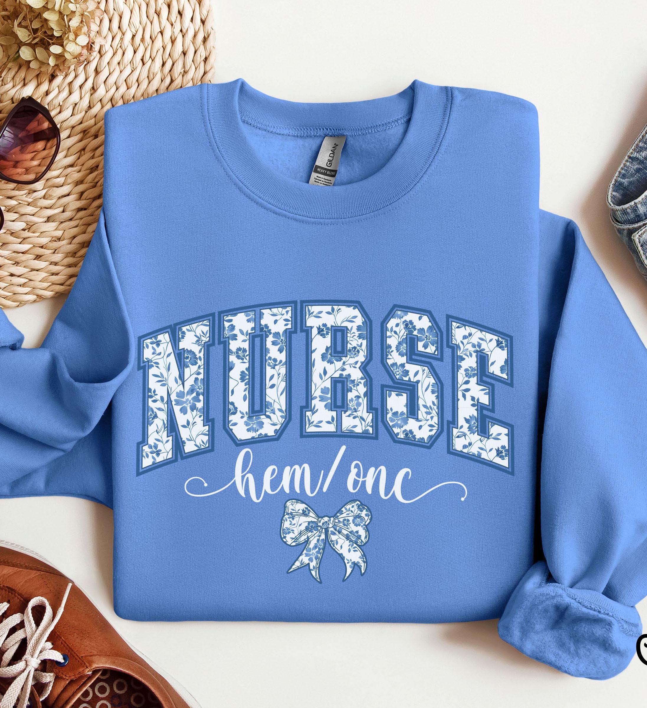 HEM ONC Sweatshirt Hematology Oncology Varsity Sweater Fleece Nurse Crew Coquette Bow RN Gift for Cancer Nurse Crewneck Nursing Sweatshirt – Soft Feel · Top Pick For Any Outfit