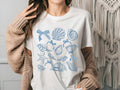 Seashell Shirt Coastal Beach T Shirt Summer Ocean Lover Tee Sea Shell Boho Shirt Beach Lover Gift Coquette Sea Shell Shirt Graphic Tee – Fan Favorite · Must-Have Style