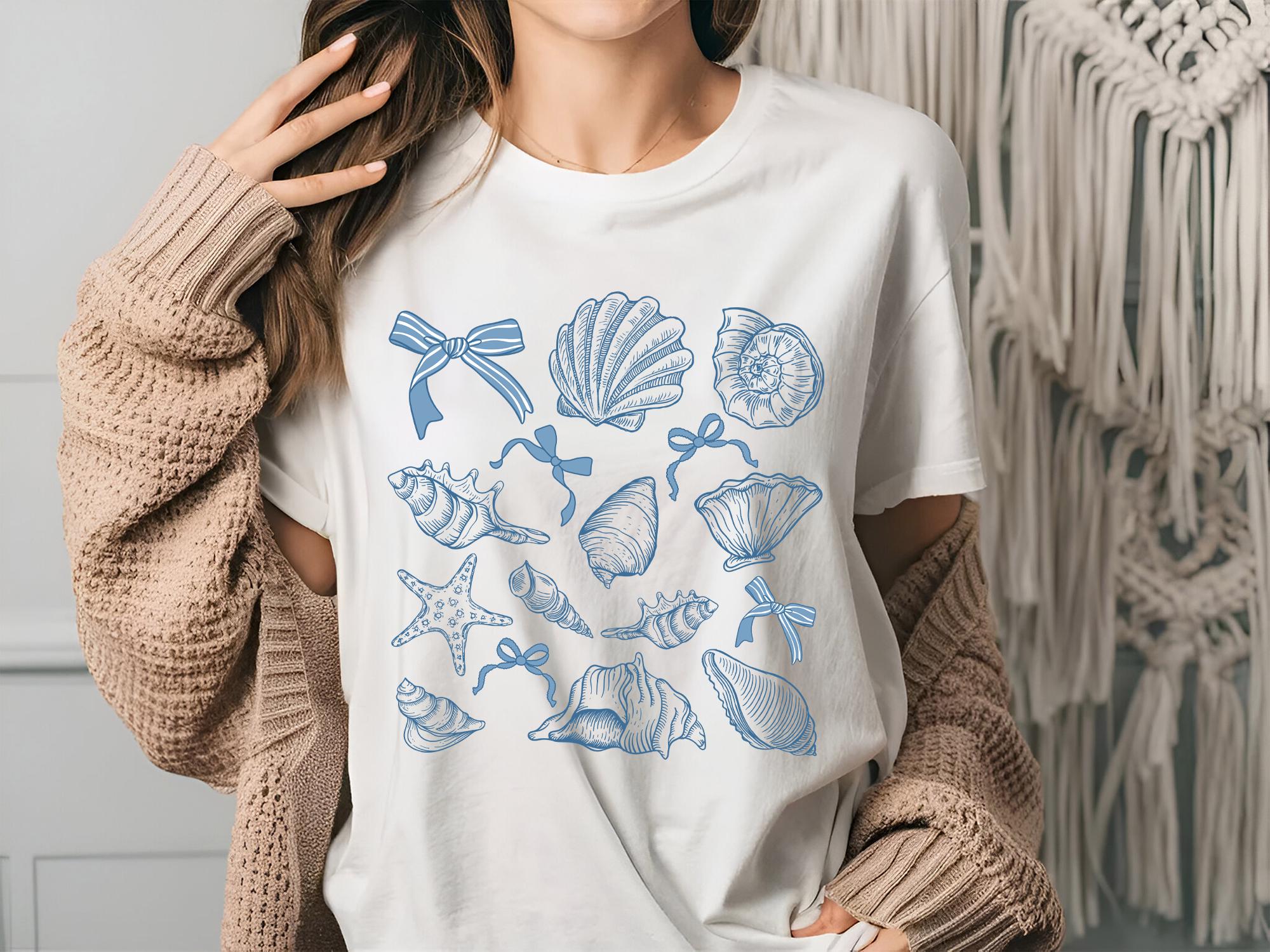 Seashell Shirt Coastal Beach T Shirt Summer Ocean Lover Tee Sea Shell Boho Shirt Beach Lover Gift Coquette Sea Shell Shirt Graphic Tee – Fan Favorite · Must-Have Style