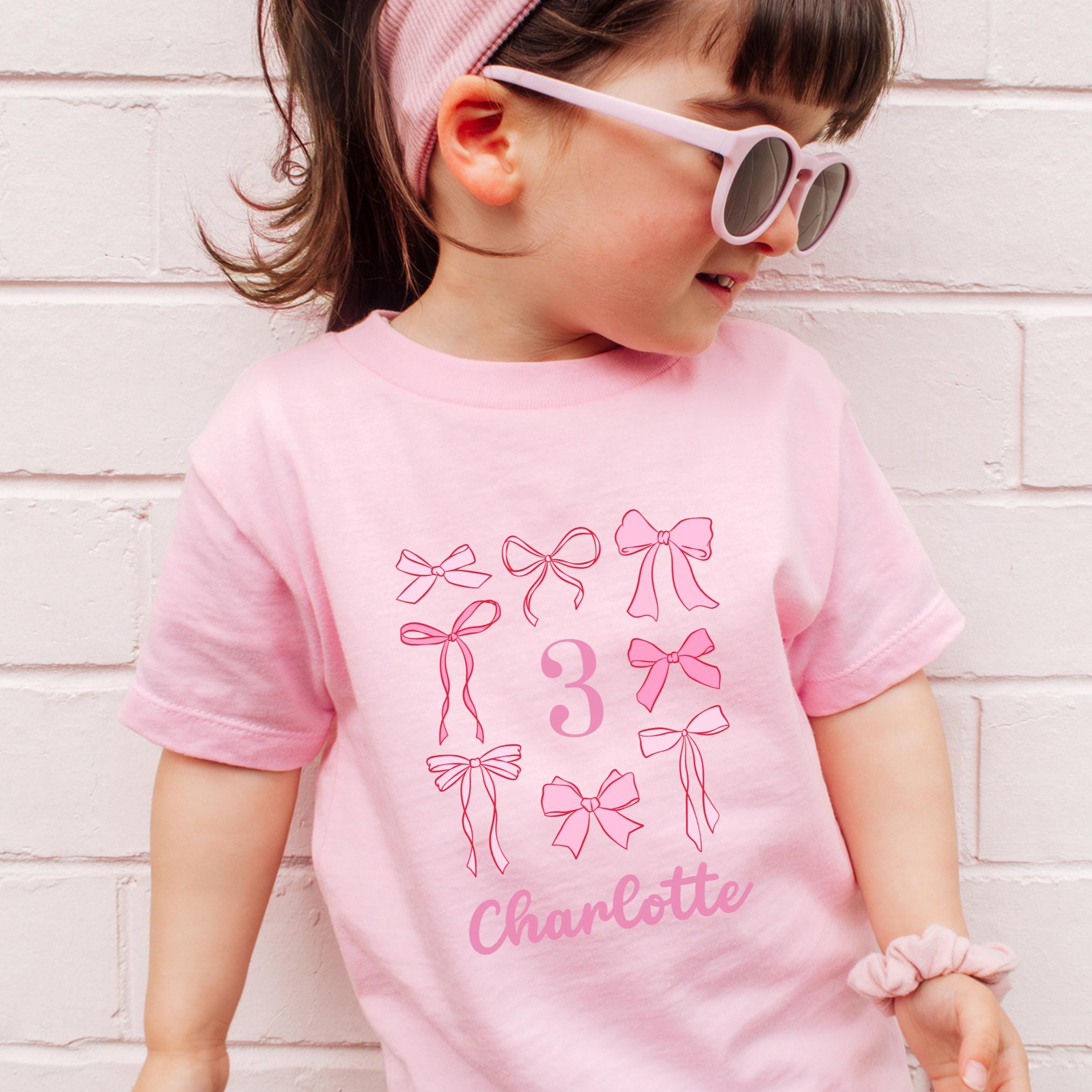 Bow Birthday Shirt Toddler Personalized Shirt Coquette Birthday T Shirt Girl Birthday Party TShirt Pink Bow Party Outfit Toddler Birthday Graphic Tee – Aesthetic Look · Trending Graphic Apparel
