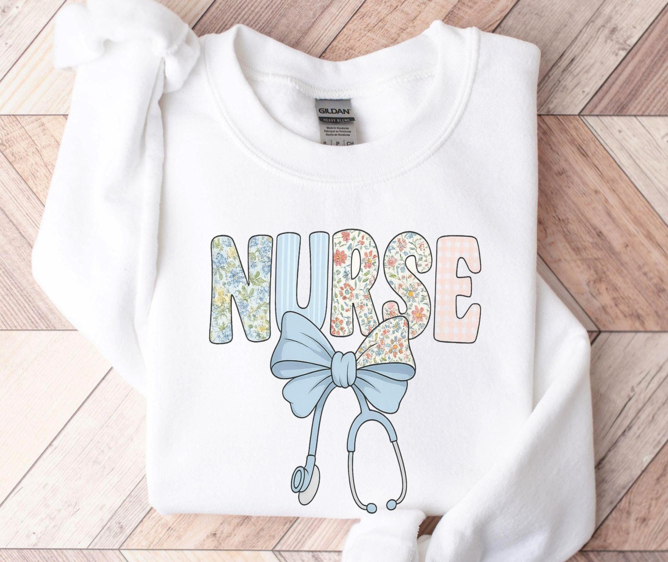 Floral Nurse Sweatshirt Cute Nurse Crewneck with Stethoscope and Bow Nurse Appreciation Gift for RN LPN Nursing Student or Grad Sweatshirt – Aesthetic Look · Trending Graphic Apparel