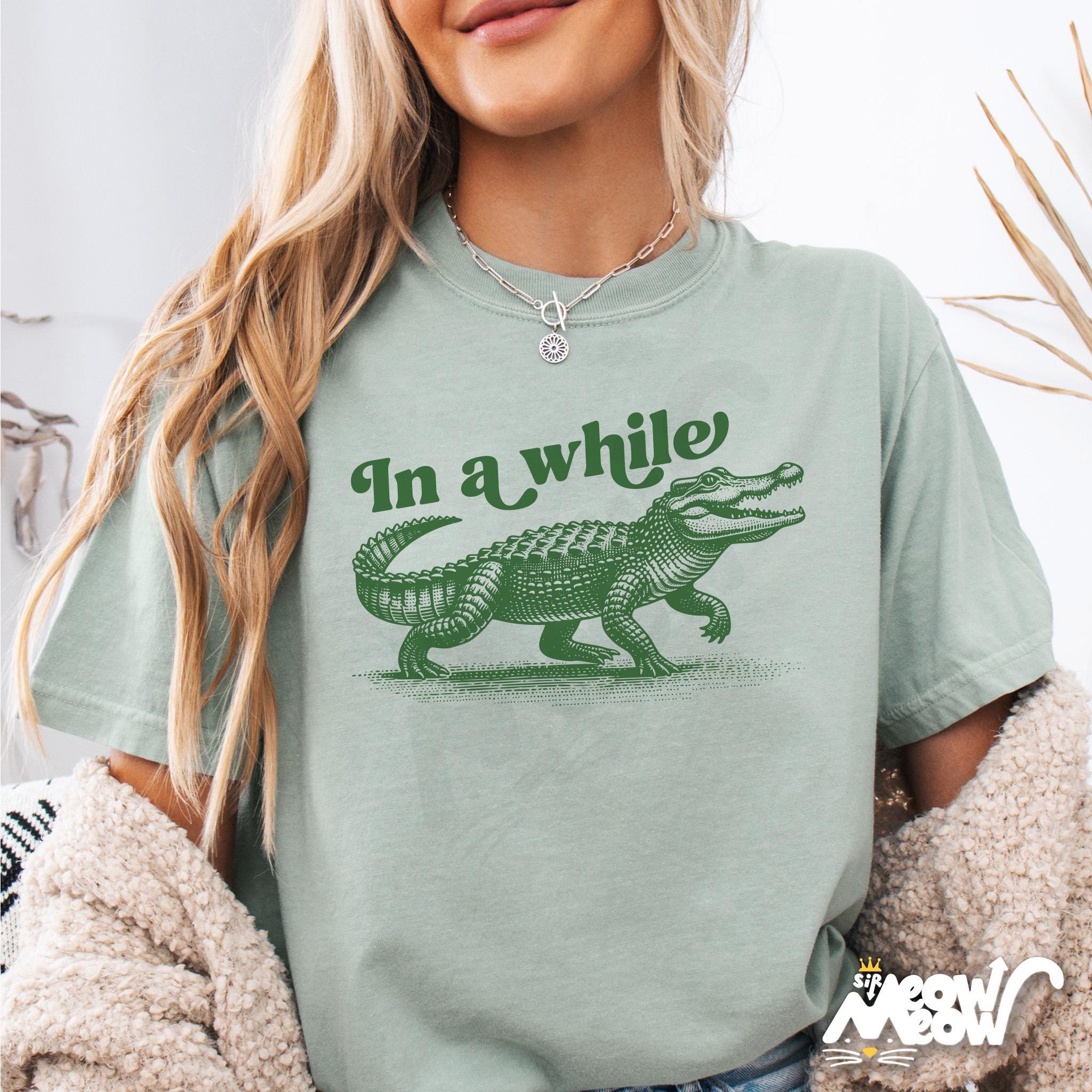 In A While Crocodile T Shirt In a While Graphic Tee Gator Shirt Retro Animal Pun TShirt Gift for Nature and Pun Lovers Graphic Tee – Feel-Good Design · Must-Have Style