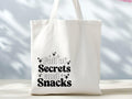 Full Of Secrets And Snacks Cotton Tote Bag Mom Life Funny Tote Bag No Plastics Sarcastic Gift Trendy Tote Bag Slogan Tote Bag Tote Bag – Feel-Good Design · Trending Graphic Apparel