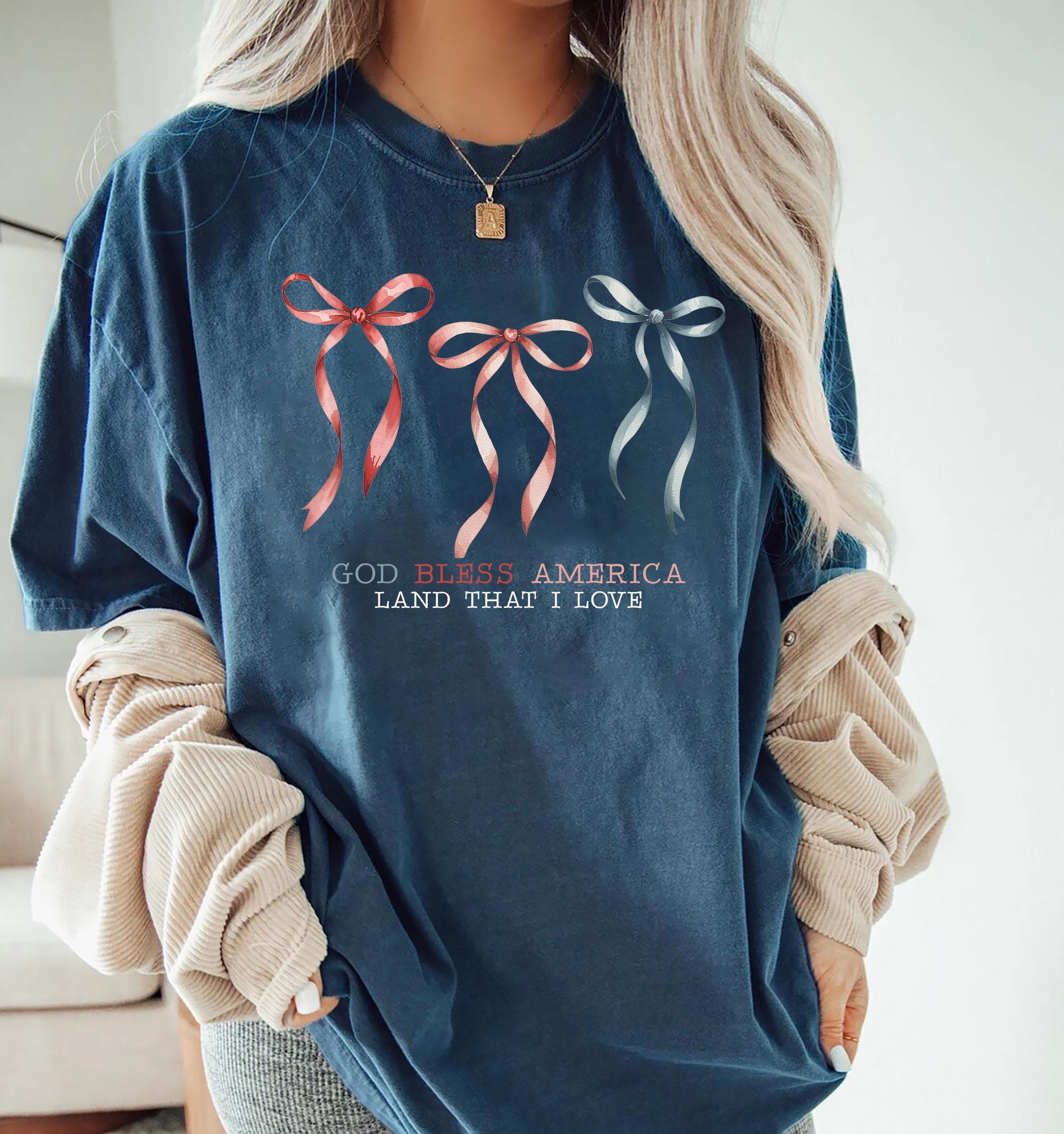 God Bless America Bow Shirt Red White and Blue Coquette USA Tee Land That I Love Shirt Cute Patriotic 4th Of July Shirt For Women Summer Tee Graphic Tee – Premium Graphic · Top Pick For Any Outfit