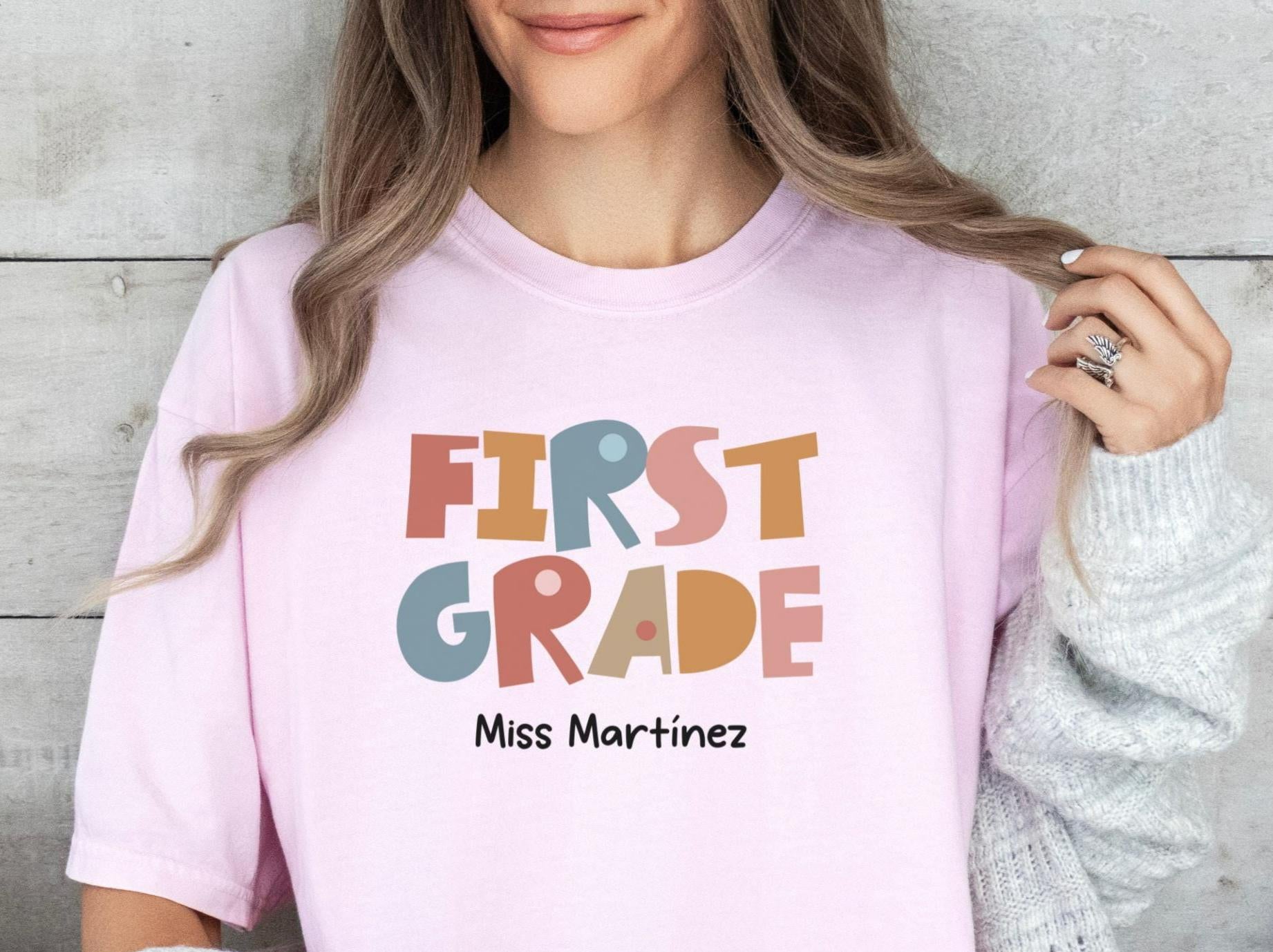 Custom 1st Grade Teacher Shirt Personalized Tee Teacher Name Back to School Teacher Gift First Grade Teacher Team Shirts Graphic Tee – Premium Graphic · High-Quality Print