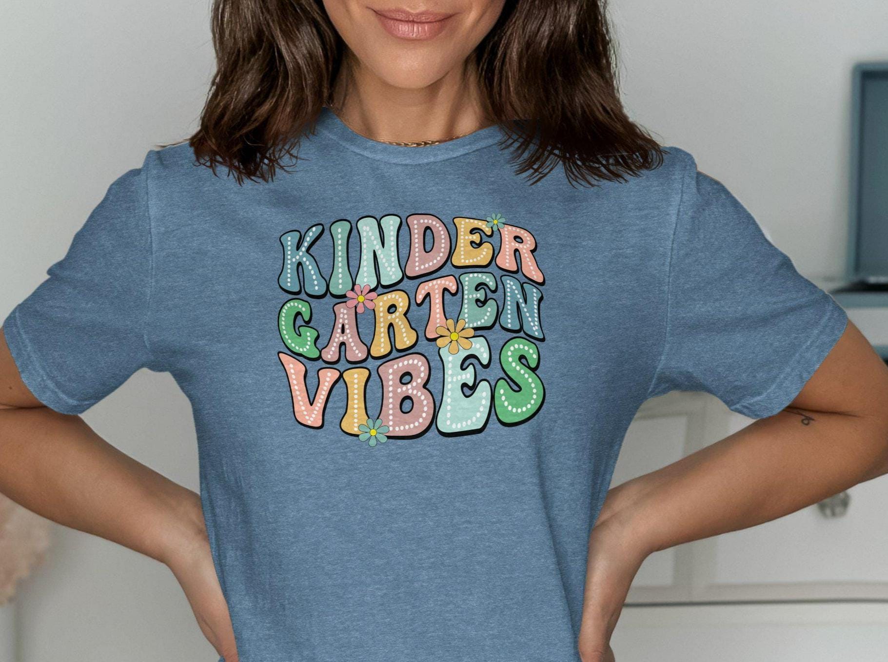 Kindergarten Vibes T Shirt Groovy Teacher Shirt Back To School Tee Retro Floral Design Teacher Gift Colorful First Day Shirt Graphic Tee – Warm & Stylish · Trending Graphic Apparel