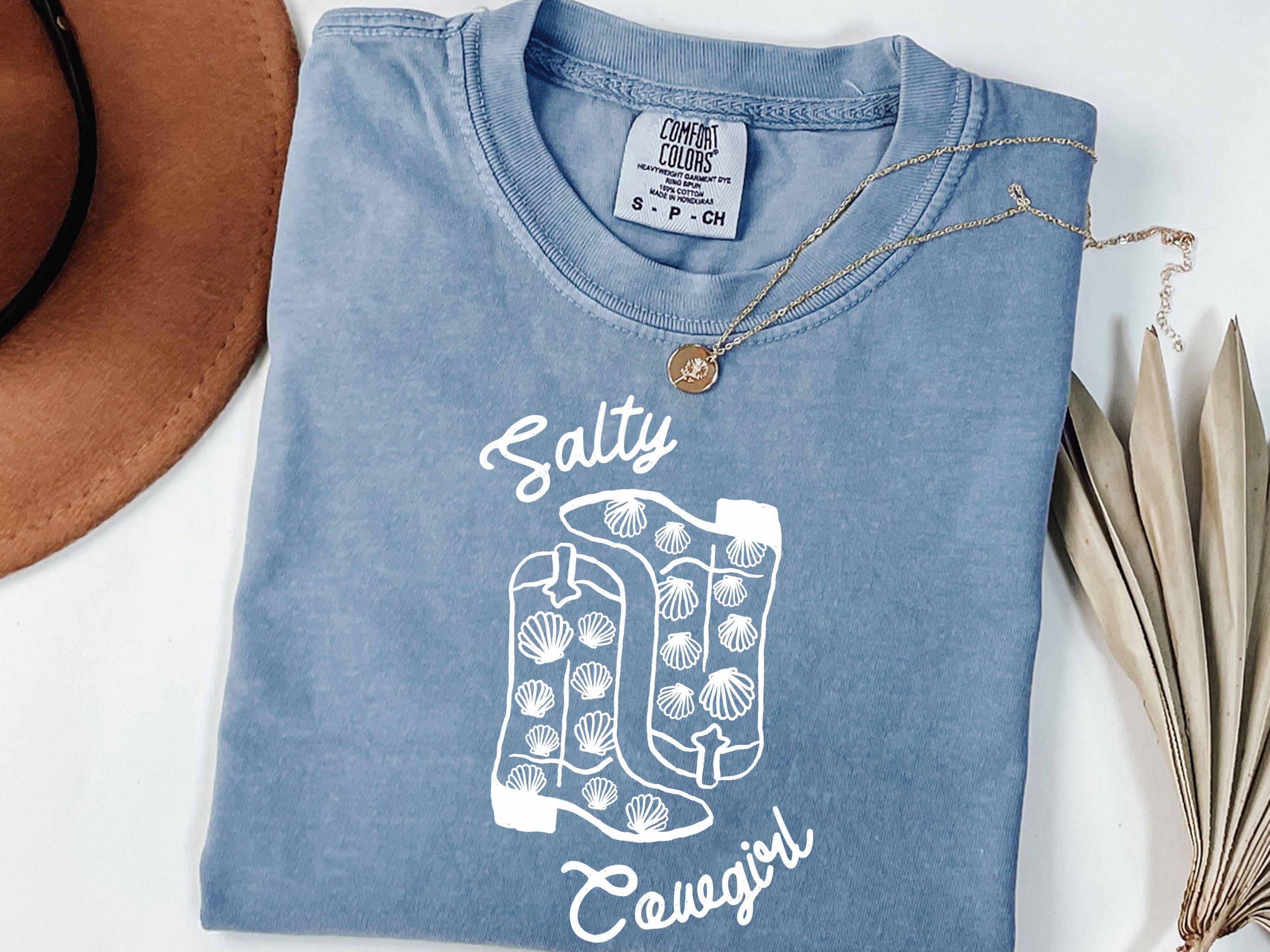 Unisex Salty Cowgirl Shirt Vintage Western Shirt Cowboy Boots Shirt Womens Western Cowgirl Shirt Trendy Graphic Tee Graphic Tee – Bold Style · Top Pick For Any Outfit
